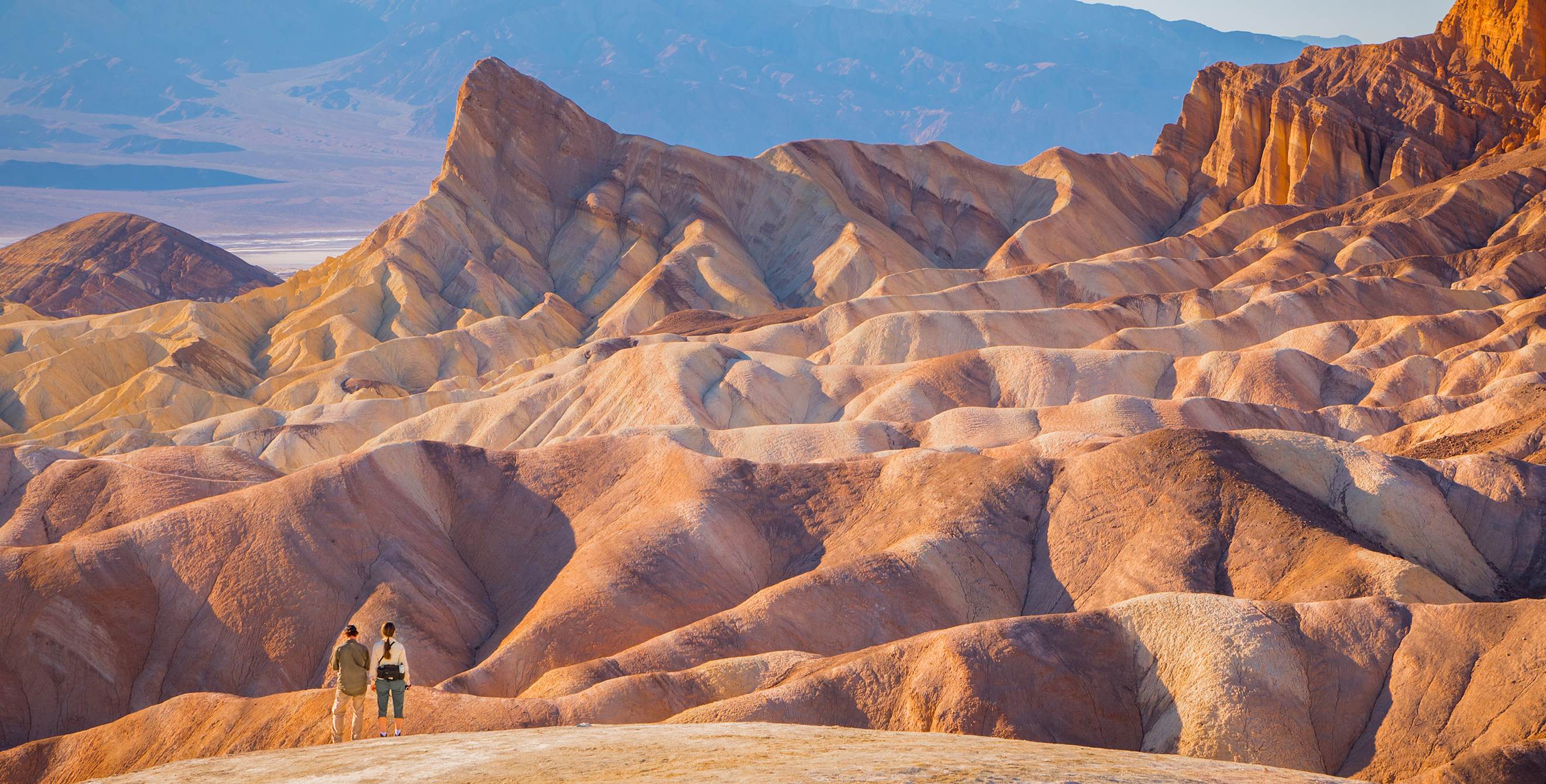 two hikers near Zabriskie Point in Death Valley National Park, image