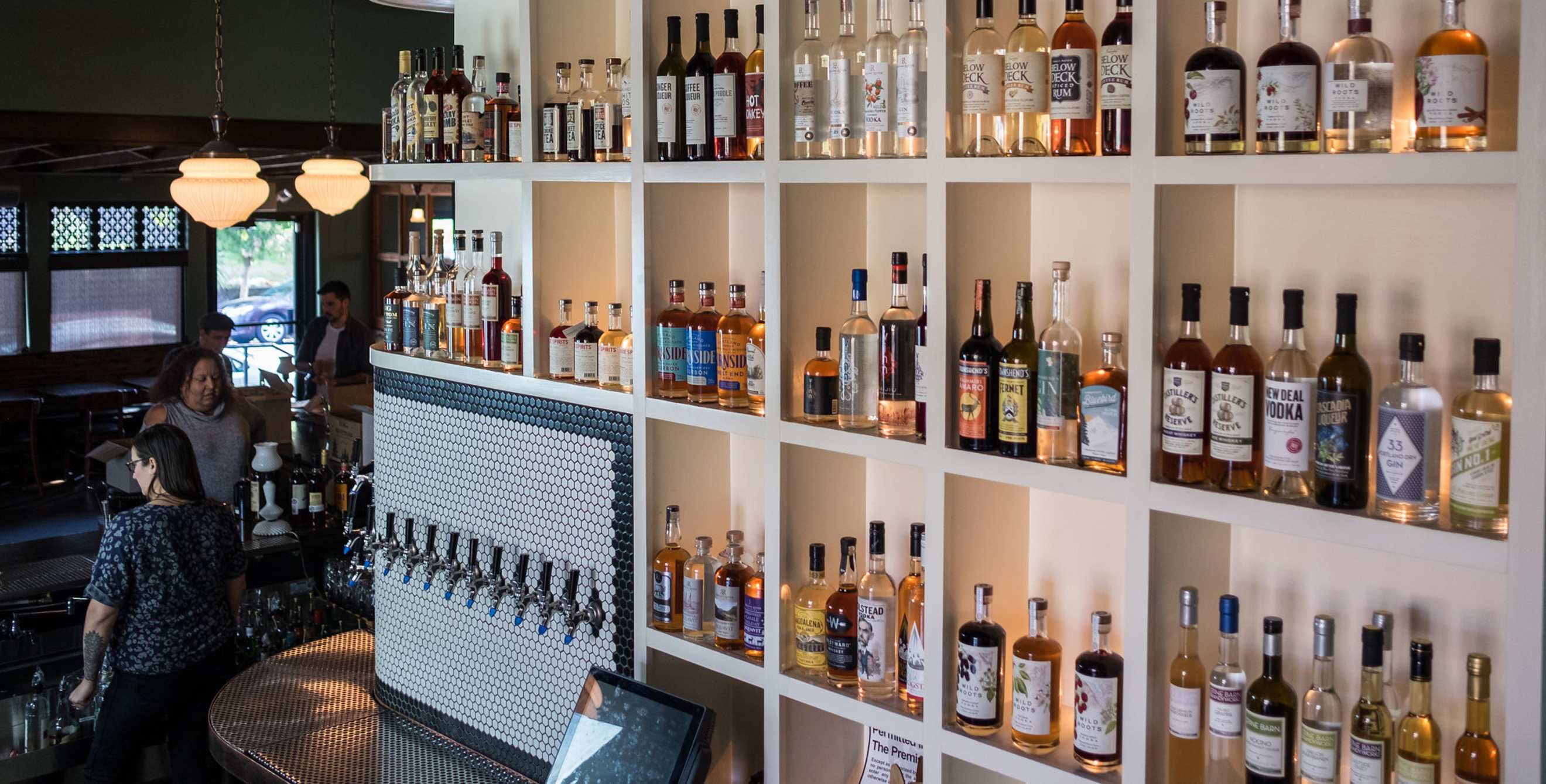Townshend's Distillery's wall of tea spirits, image