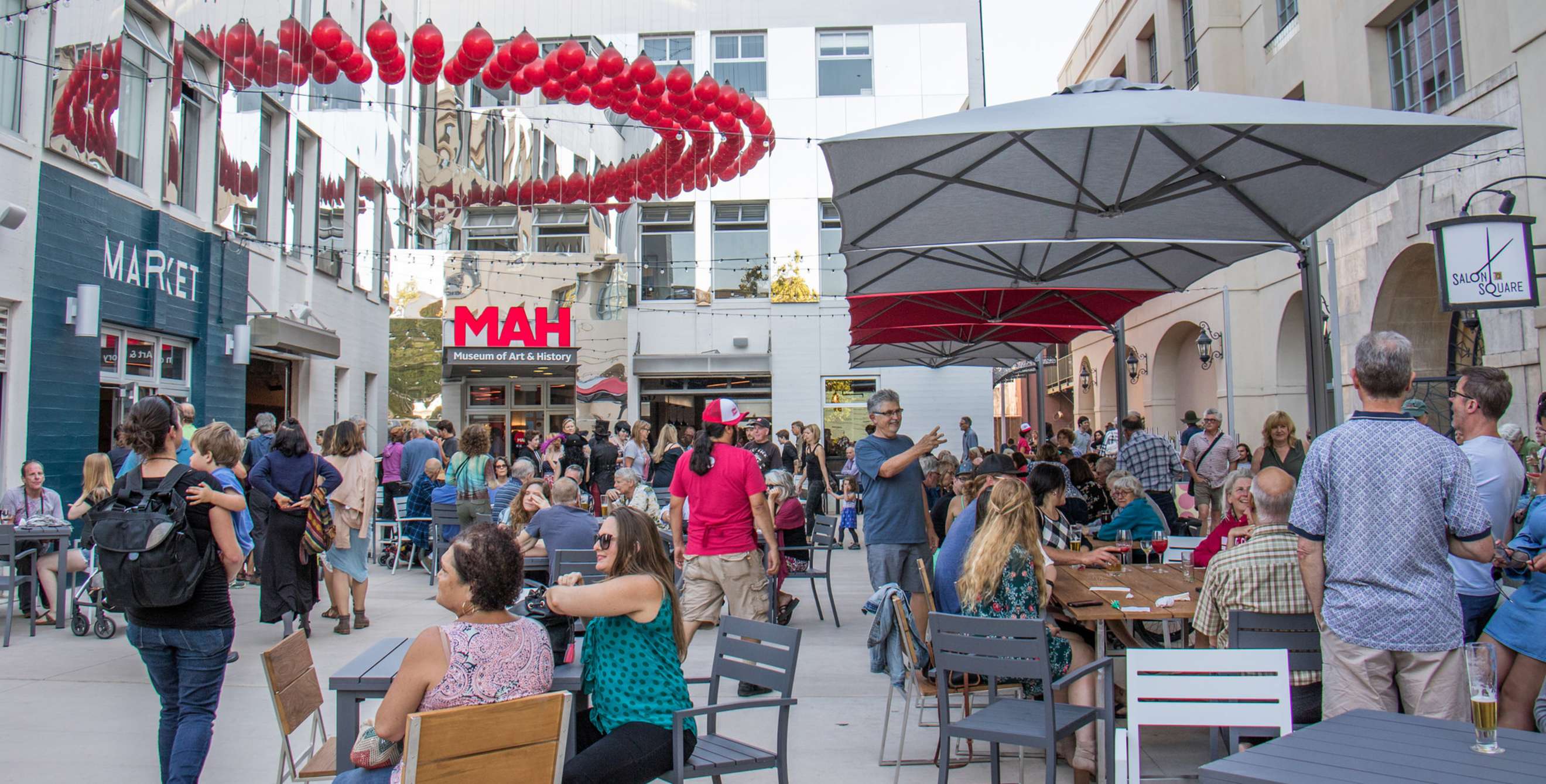 crowd of people gathering and dining at Abbott Square Market in Santa Cruz, photo