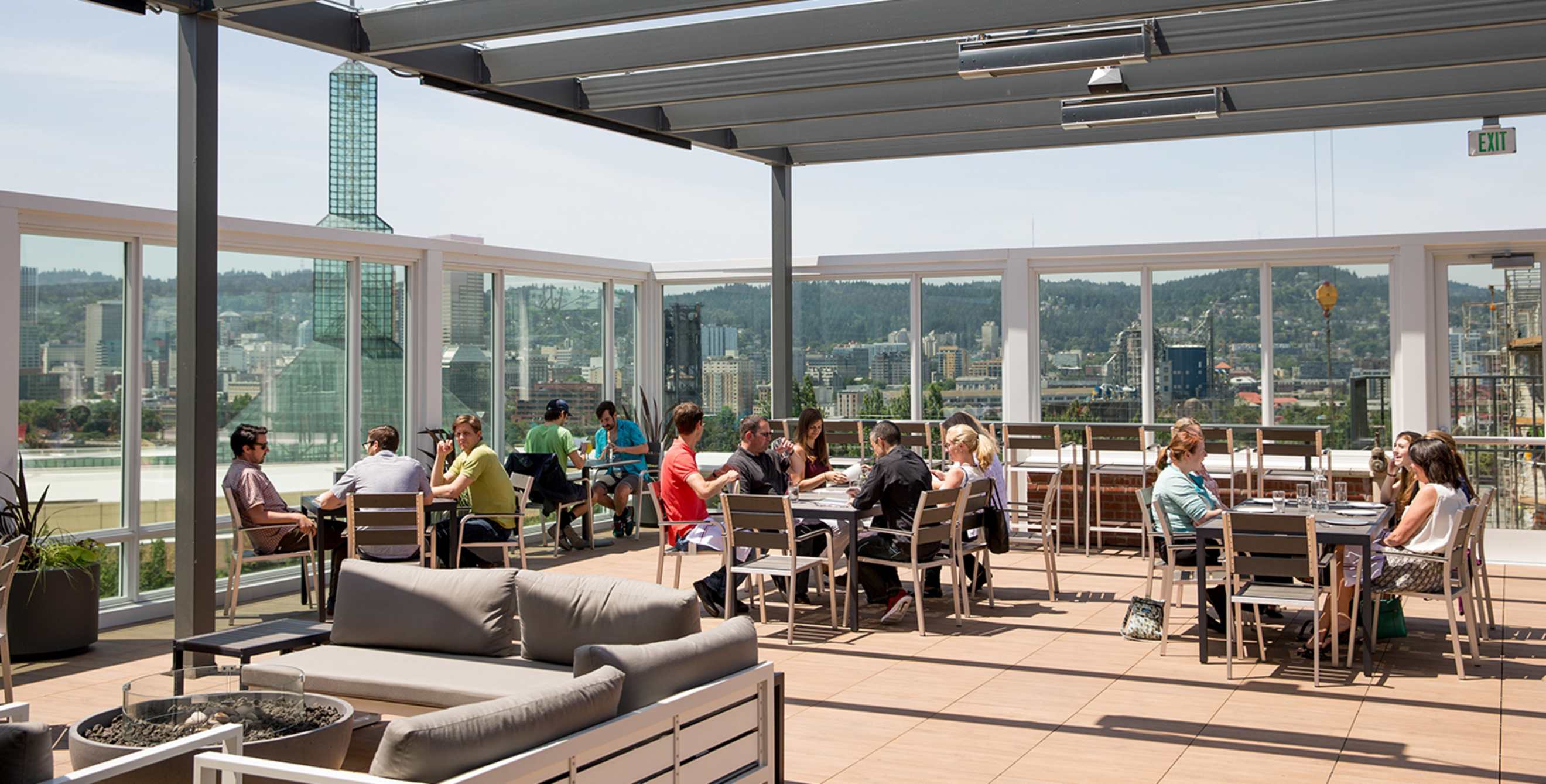 the Portland, Oregon, cityscape is the backdrop to the spacious patio at Altabira City Tavern, picture
