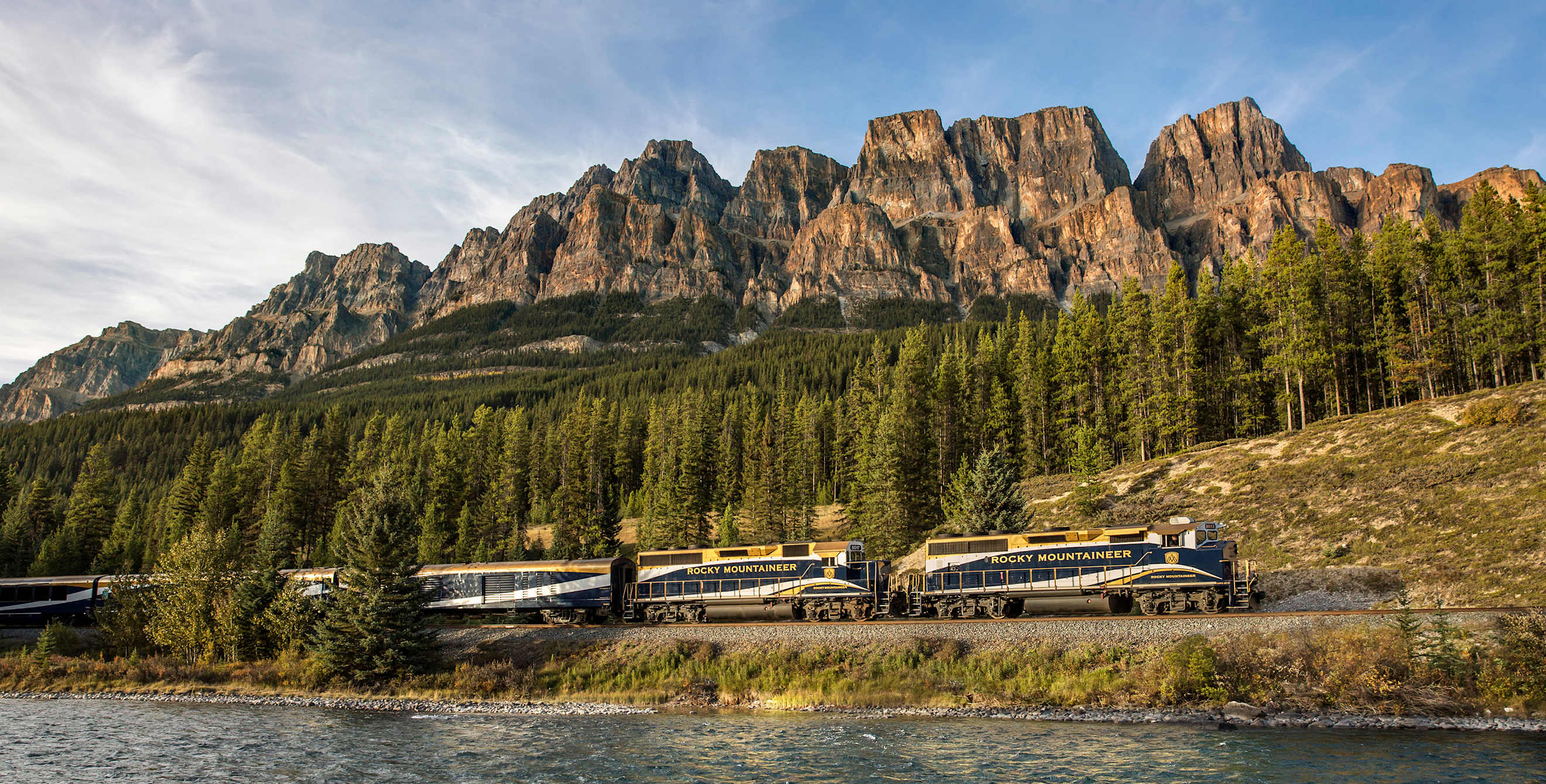 The Rocky Mountaineer rolls past Castle Mountain in Alberta, Canada, photo