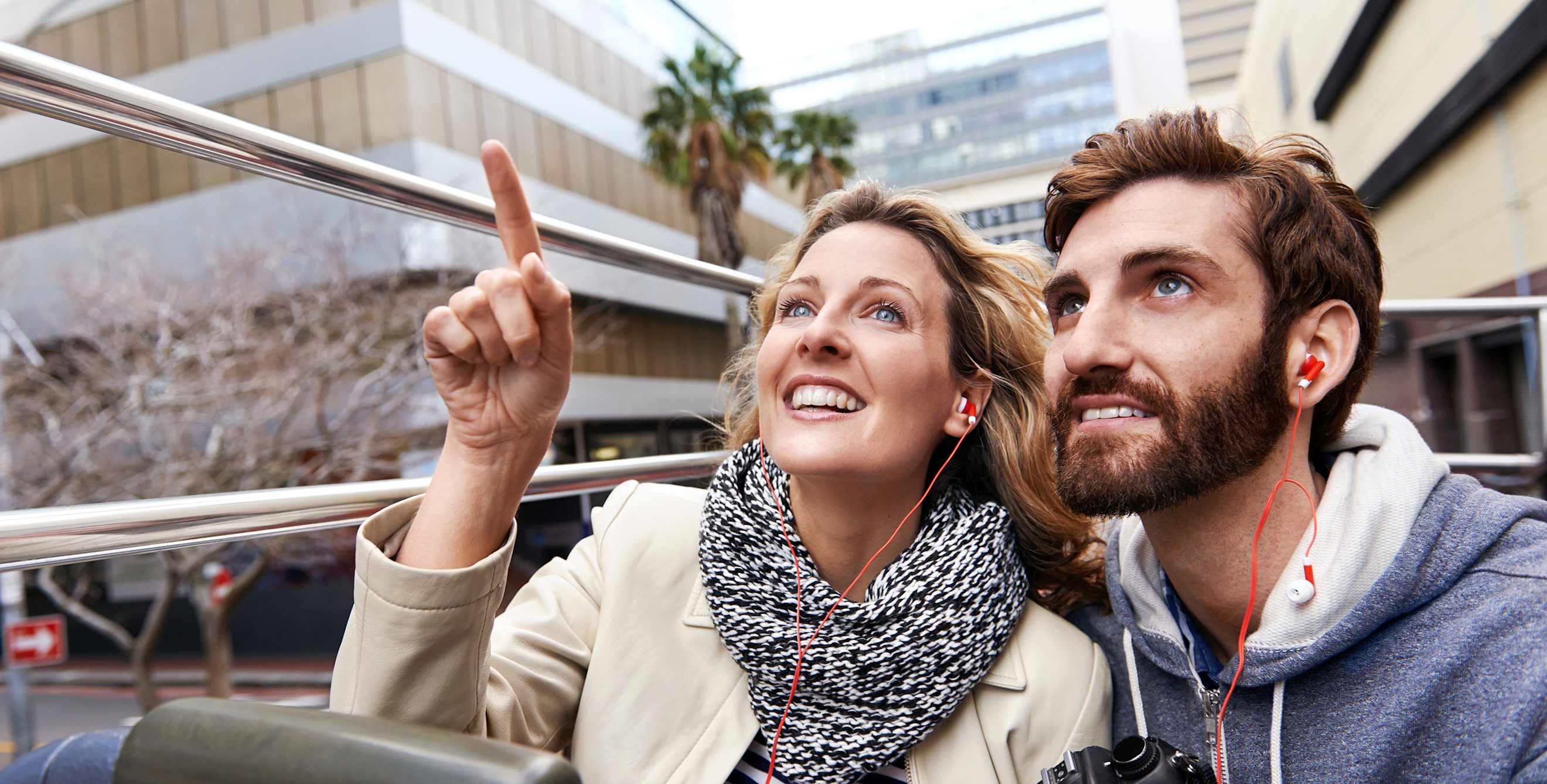 Couple on a sightseeing bus tour on vacation, photo