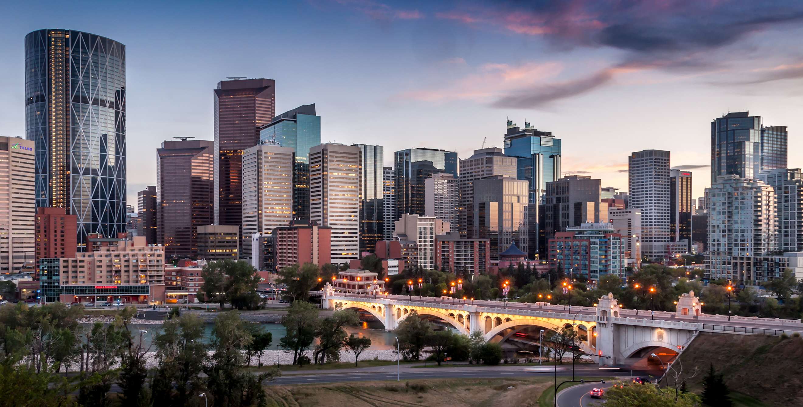 Calgary skyline at night with Bow River and Centre Street Bridge, photo