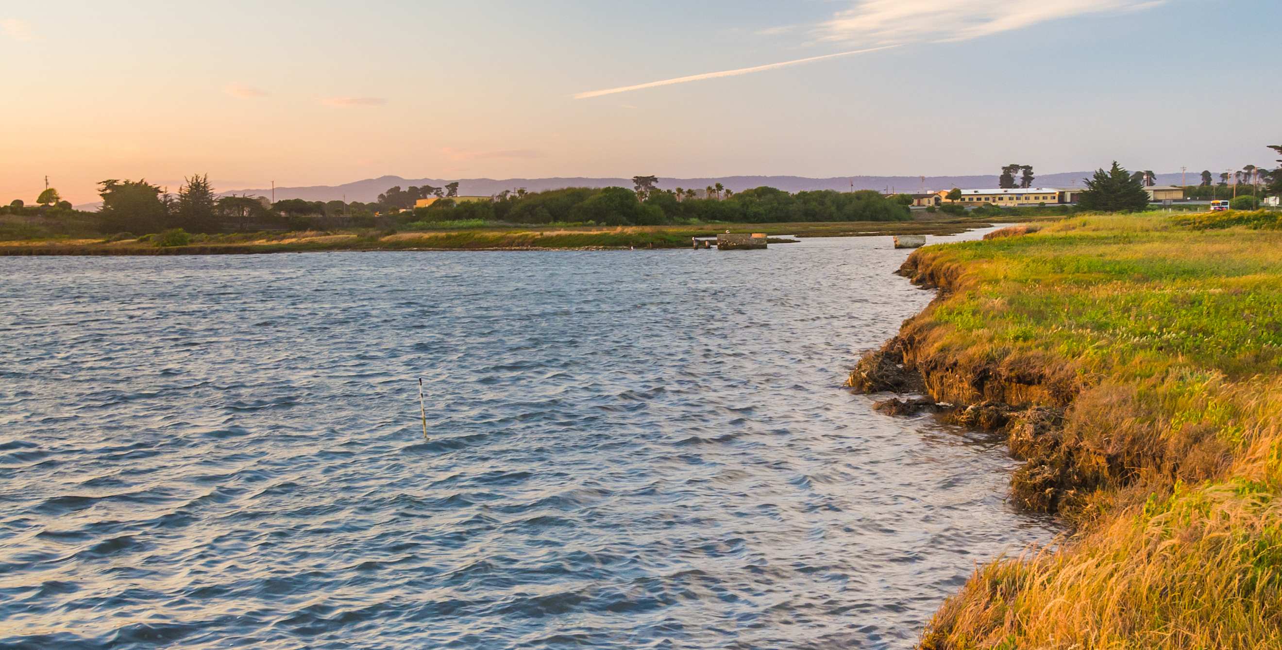 Sunset over a marsh at Moss Landing State Park, California.