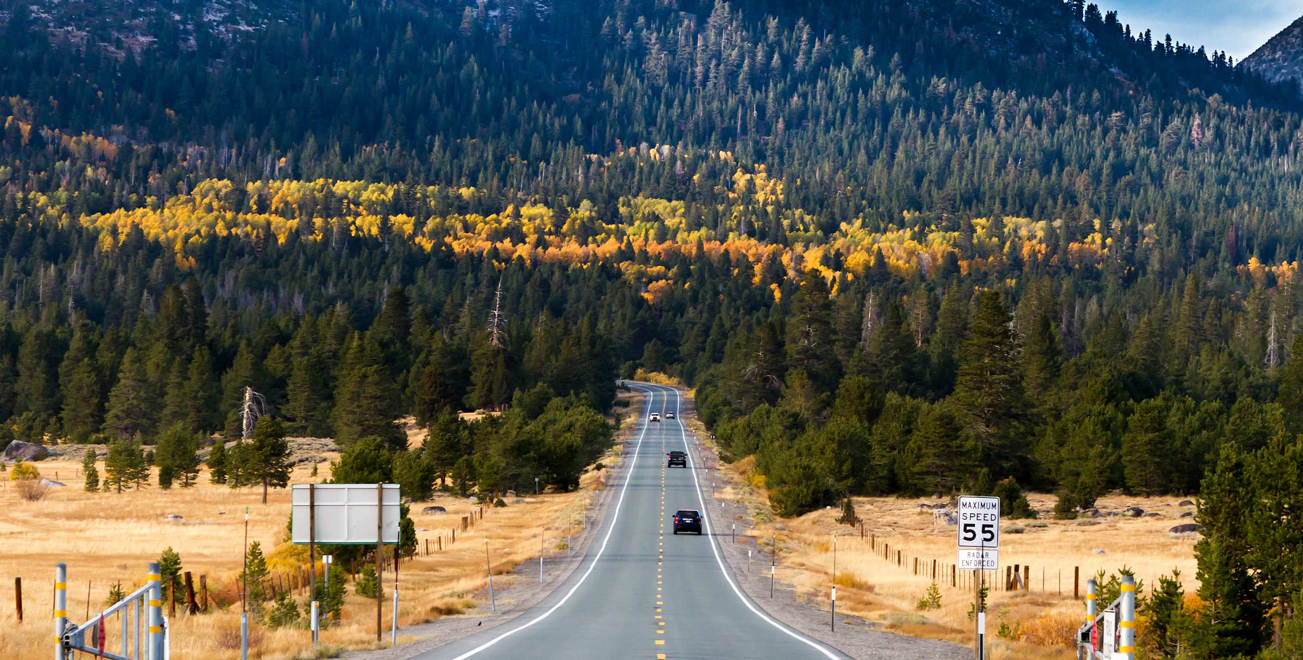 Orange and green foliage blankets Hope Valley along State Route 89 near Lake Tahoe, California