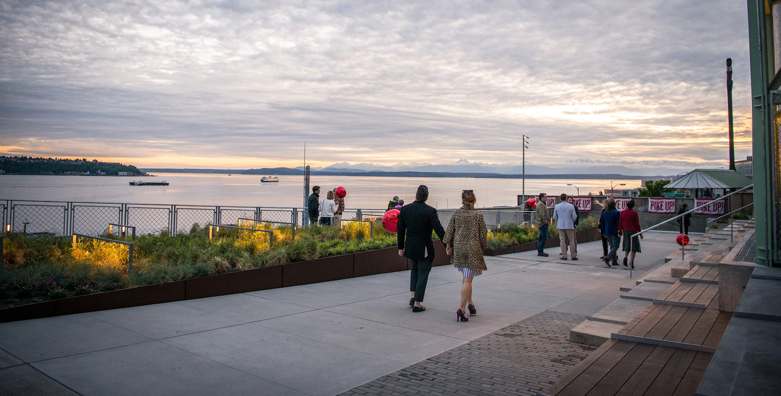 pedestrians stroll along Puget Sound at MarketFront at Pike Place Market, image