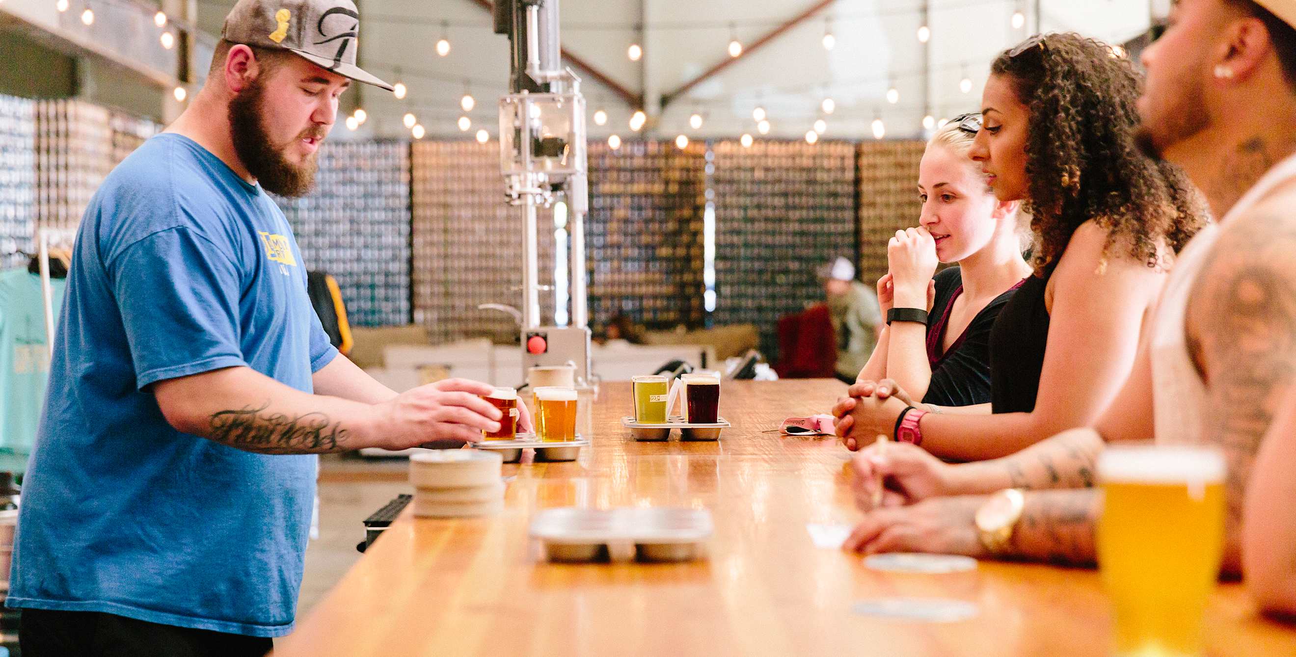 People at the bar in the tasting room at 21st Amendment Brewery in San Leandro