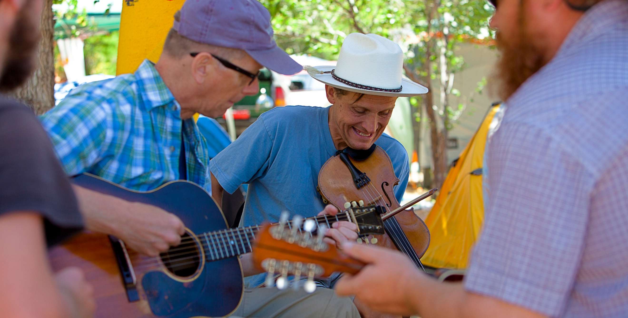 fiddler accompanied by two guitarists outdoors in Weiser, Idaho, picture