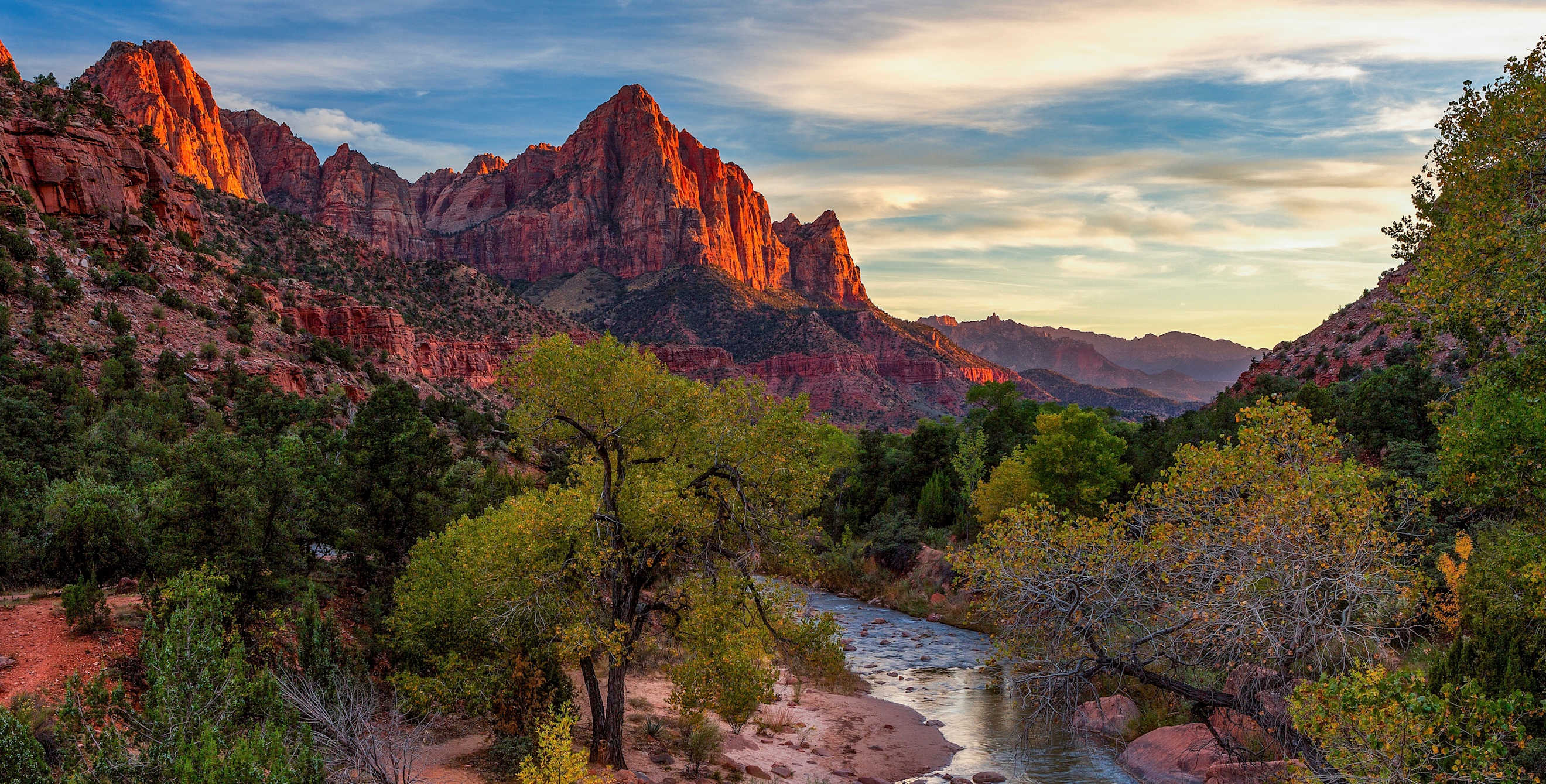 river winds through colorful canyon in Zion National Park, Utah