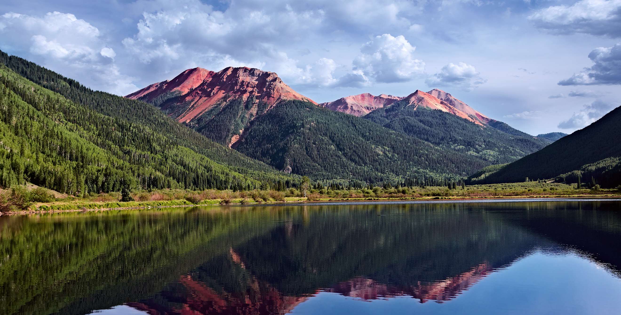 Colorado's San Juan Mountains reflect on water