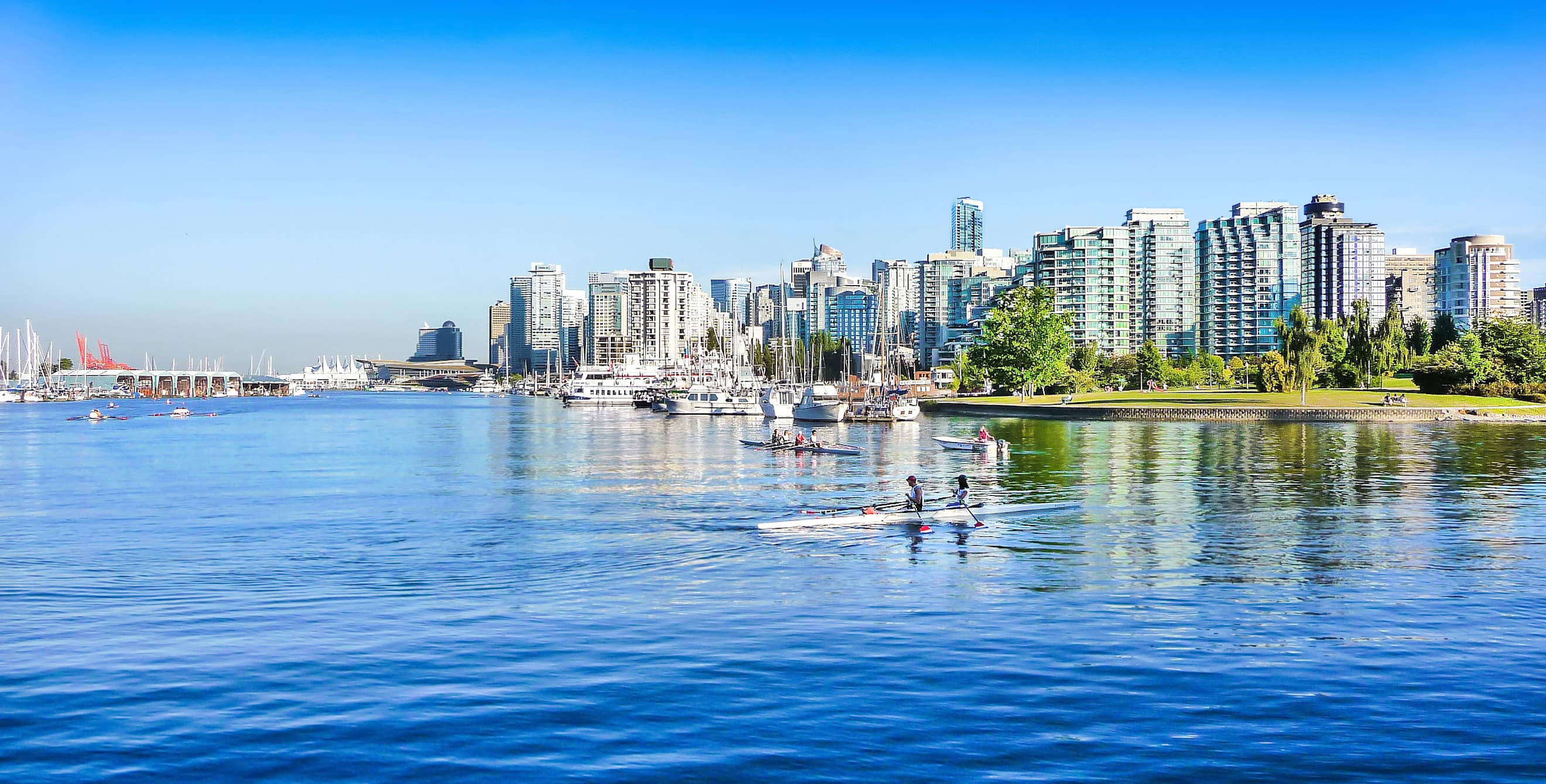 The Vancouver skyline on a sunny day with blue sky.