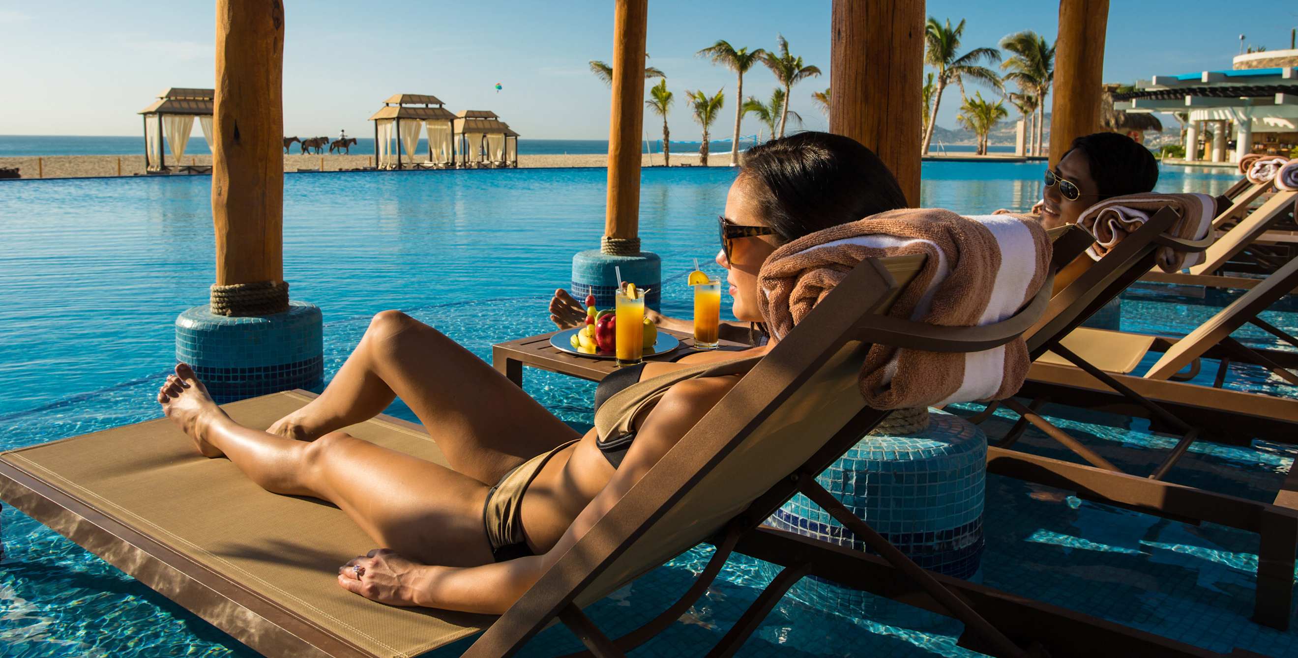 AAA Member lounges at the pool at the Hyatt Ziva Los Cabos.