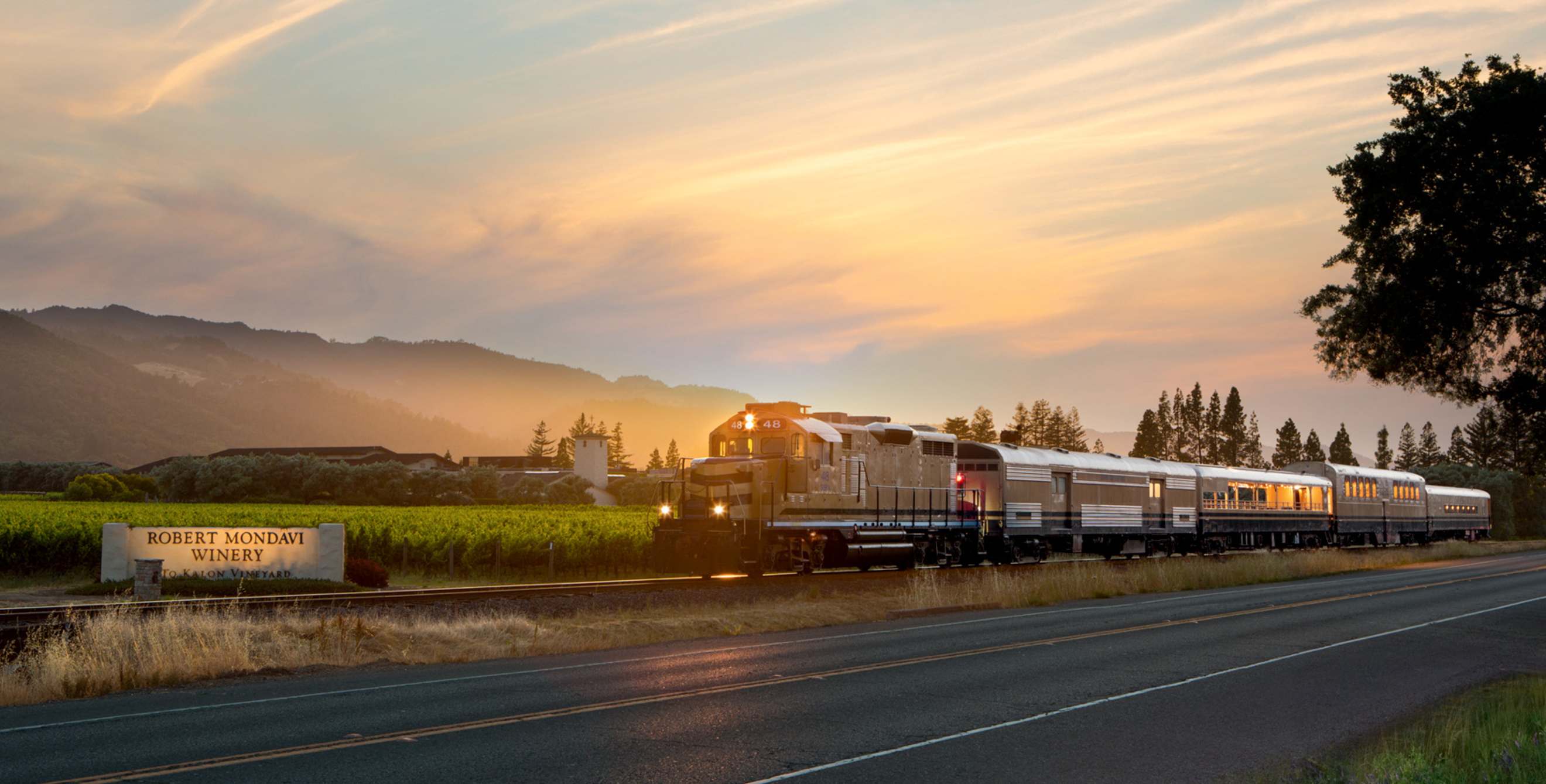 The Wine Train passes the Robert Mondavi Winery's To Kalon vineyard during late afternoon in Oakville, California