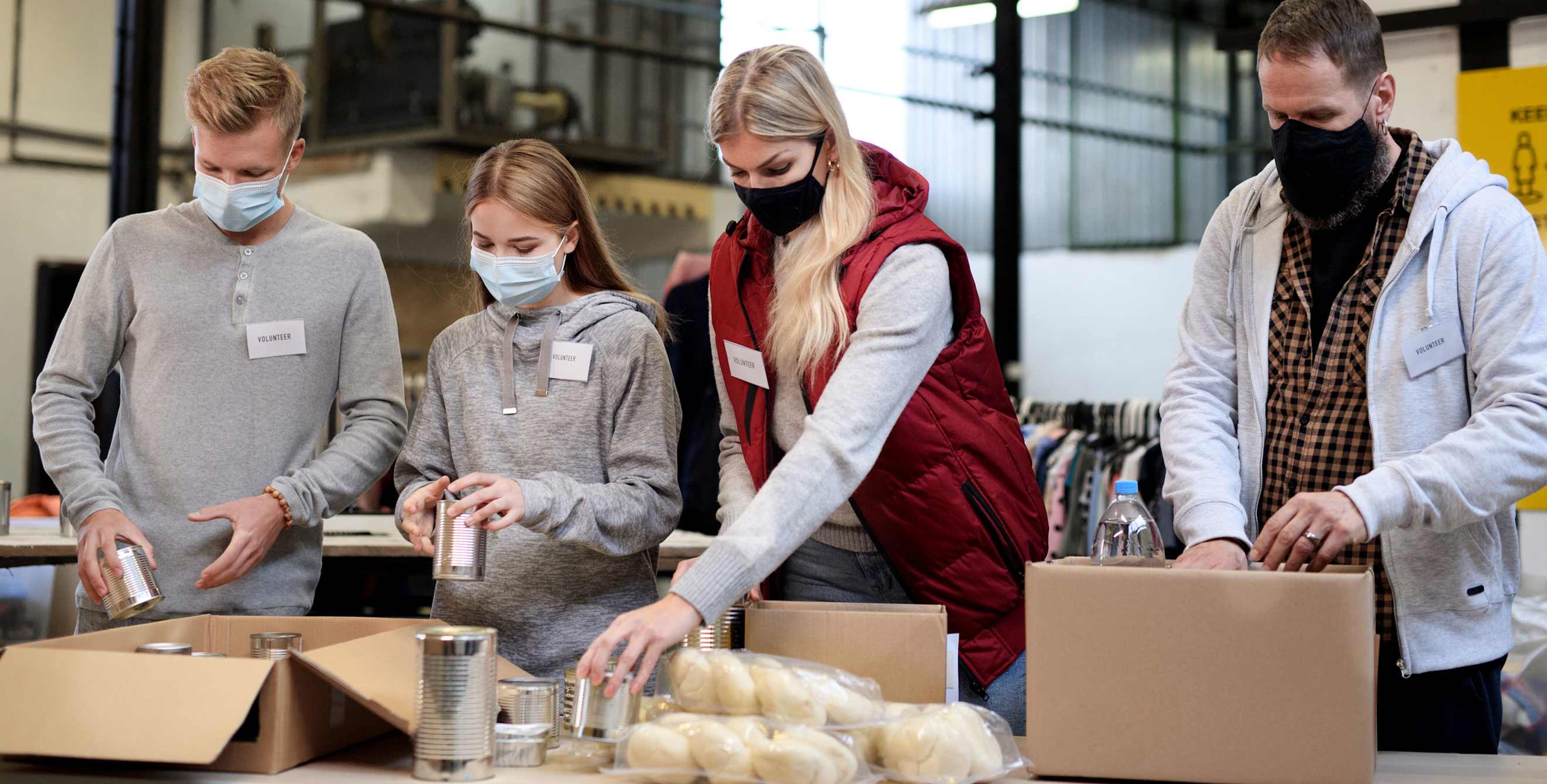 A family volunteers at a food bank together.