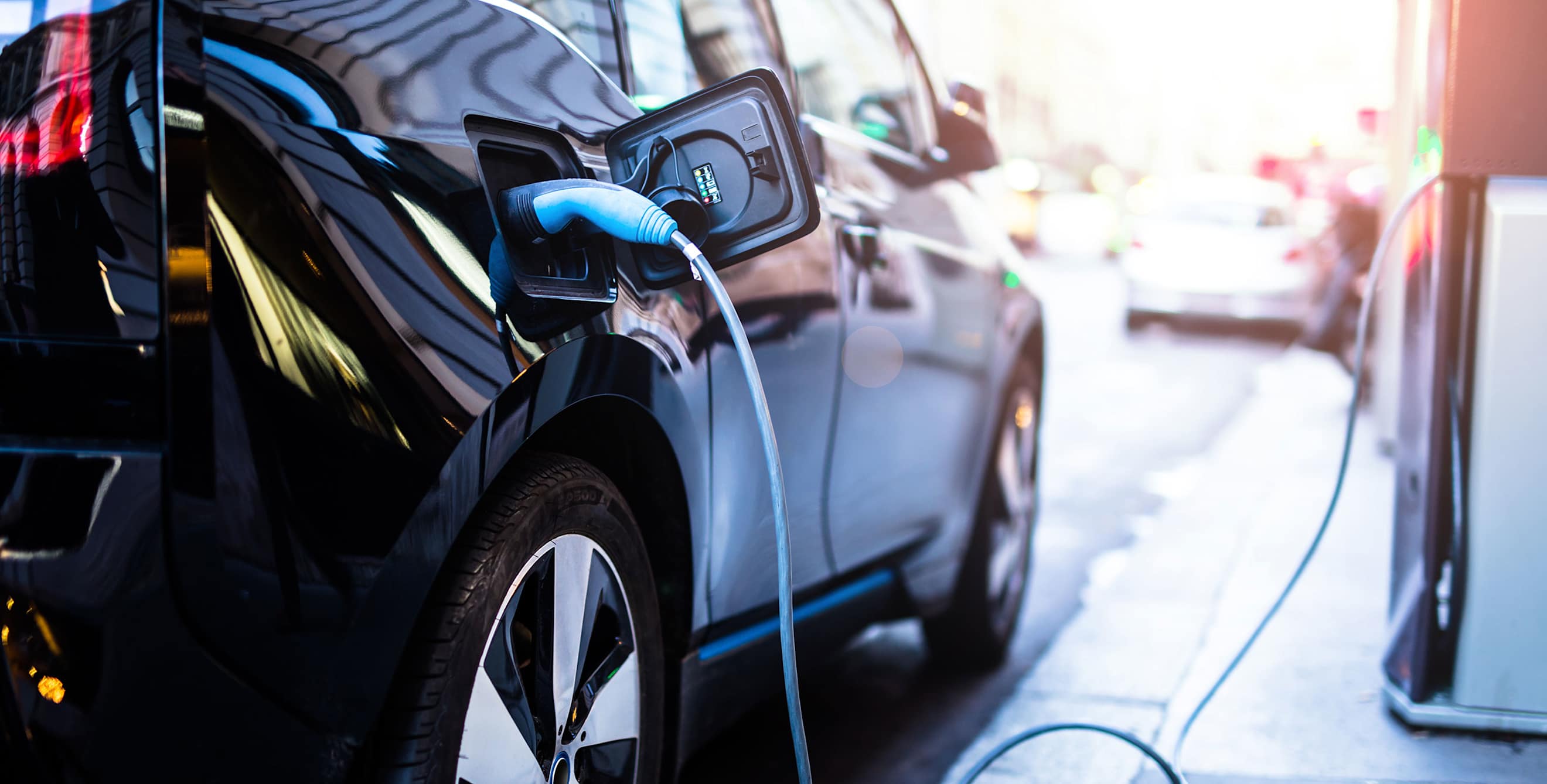 Close up view of an electric vehicle at a charging station