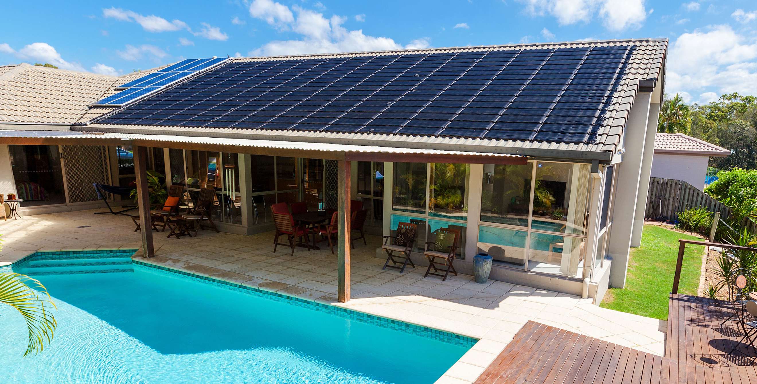 A home with solar panels and solar hot water heating on the roof.