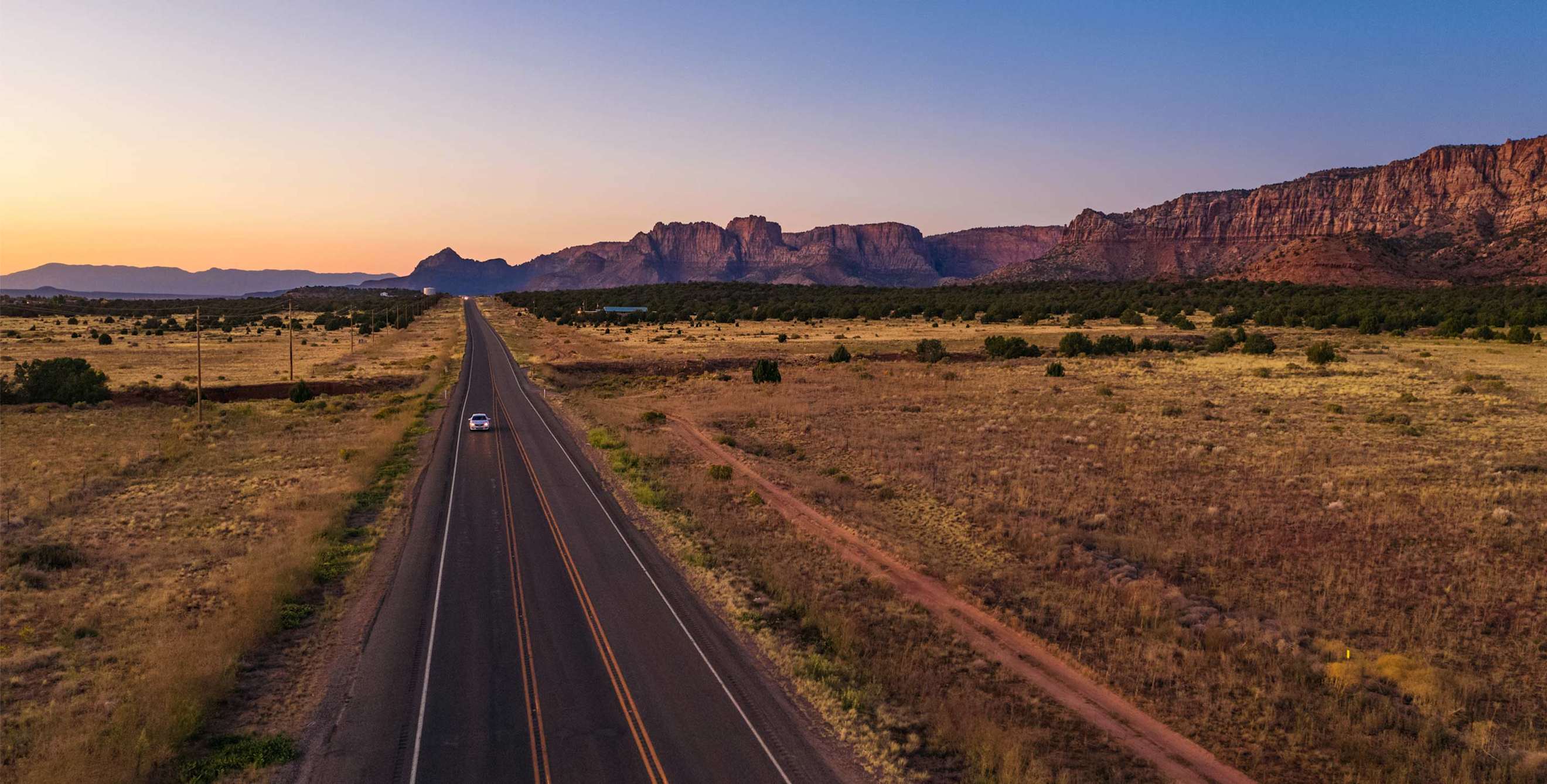 car driving on road near zion national park in utah
