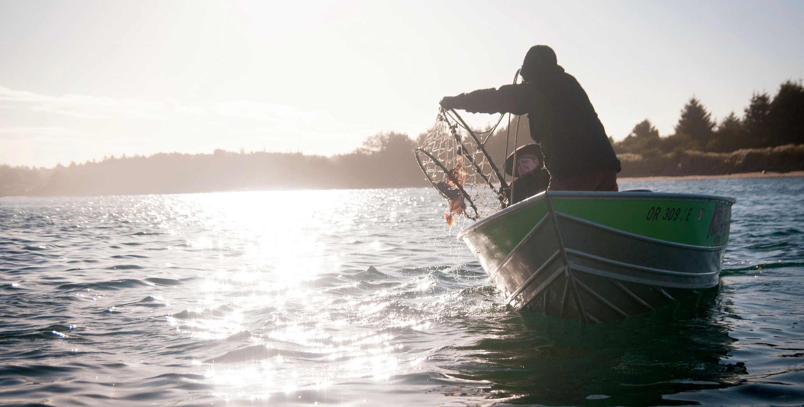 Fisherman checking crab pots off Oregon coast.