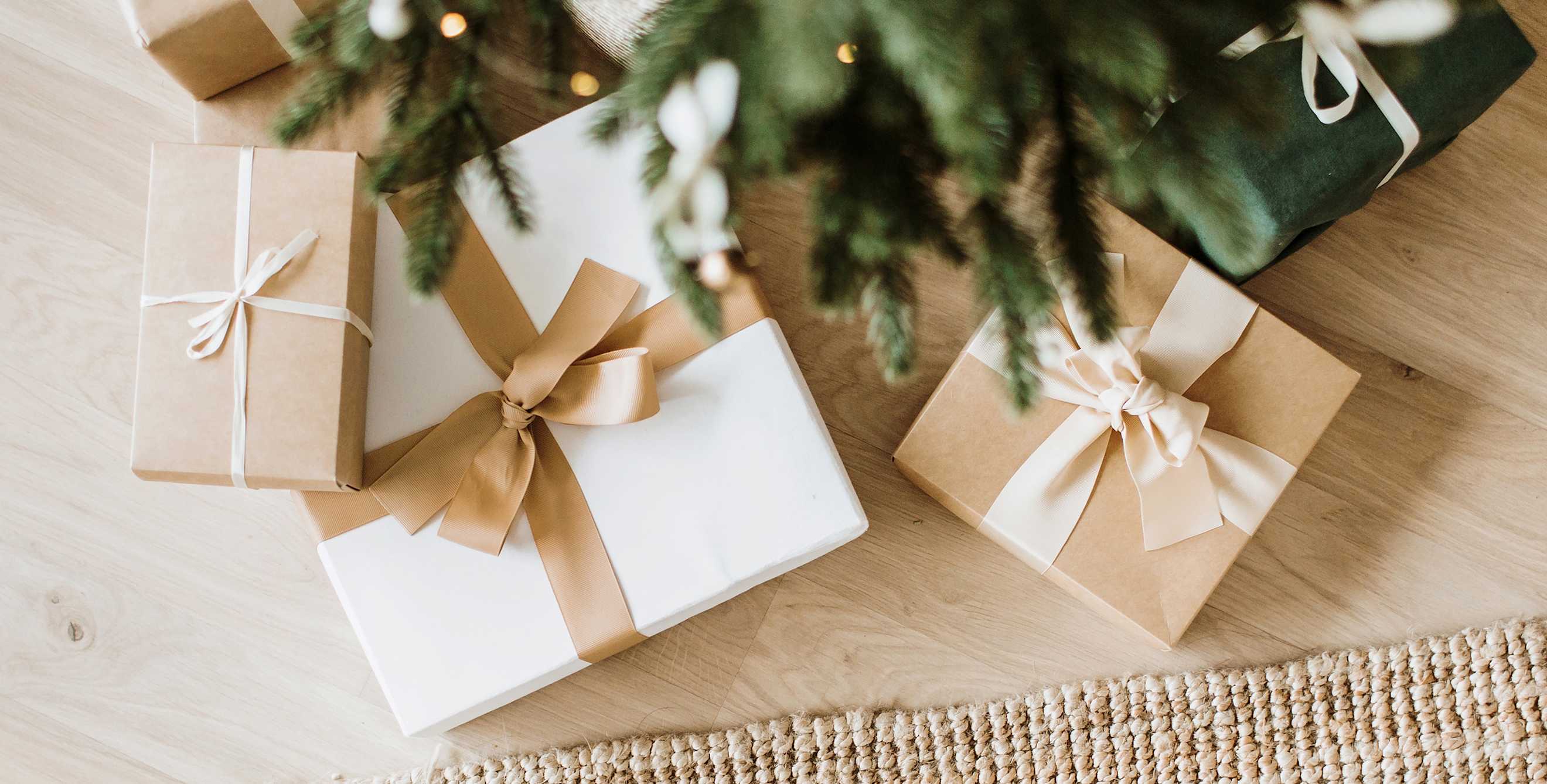 Sustainably wrapped presents under the Christmas tree.