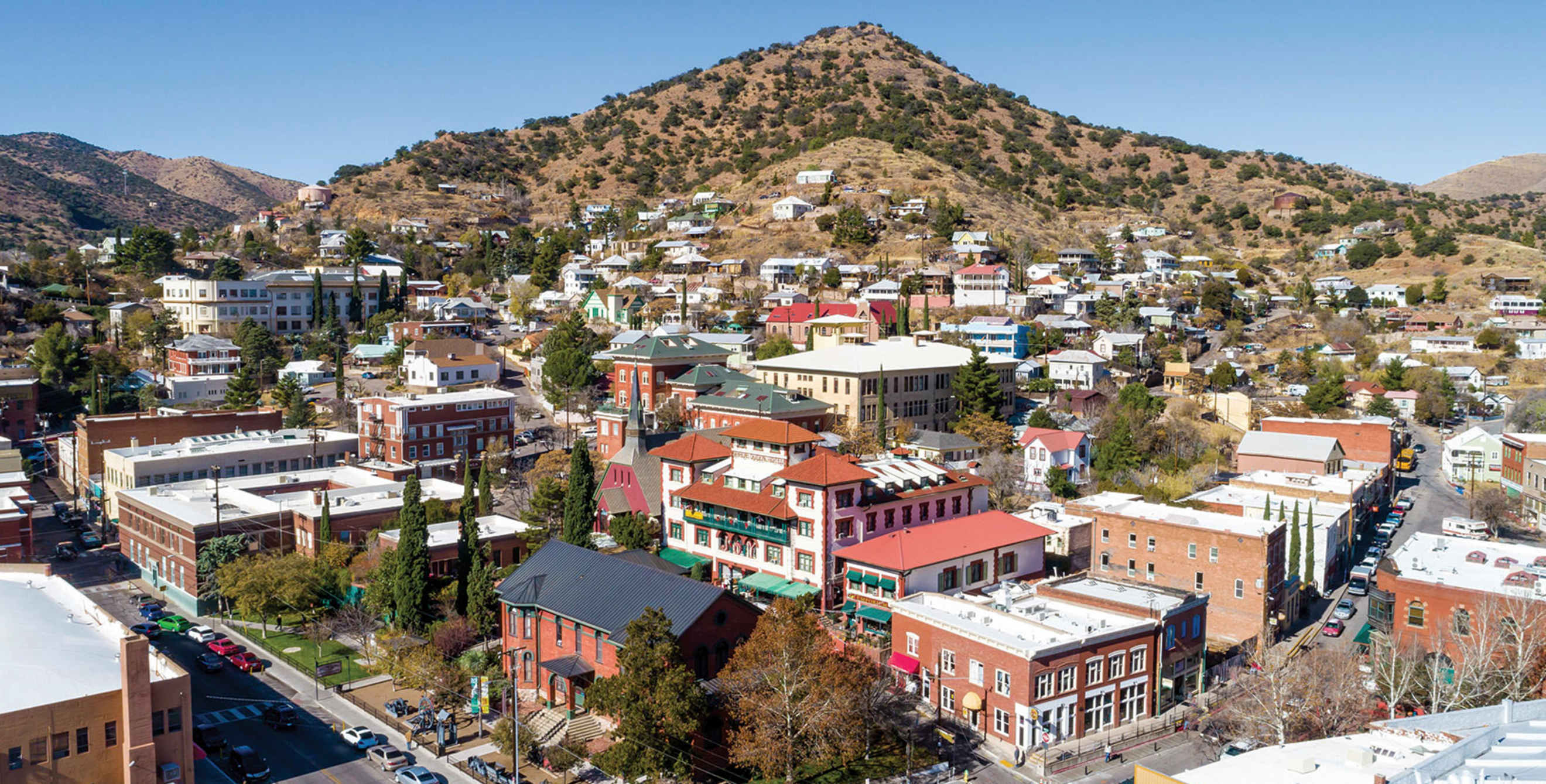 Elevated view across downtown Bisbee, Arizona, on a clear, cloudless day