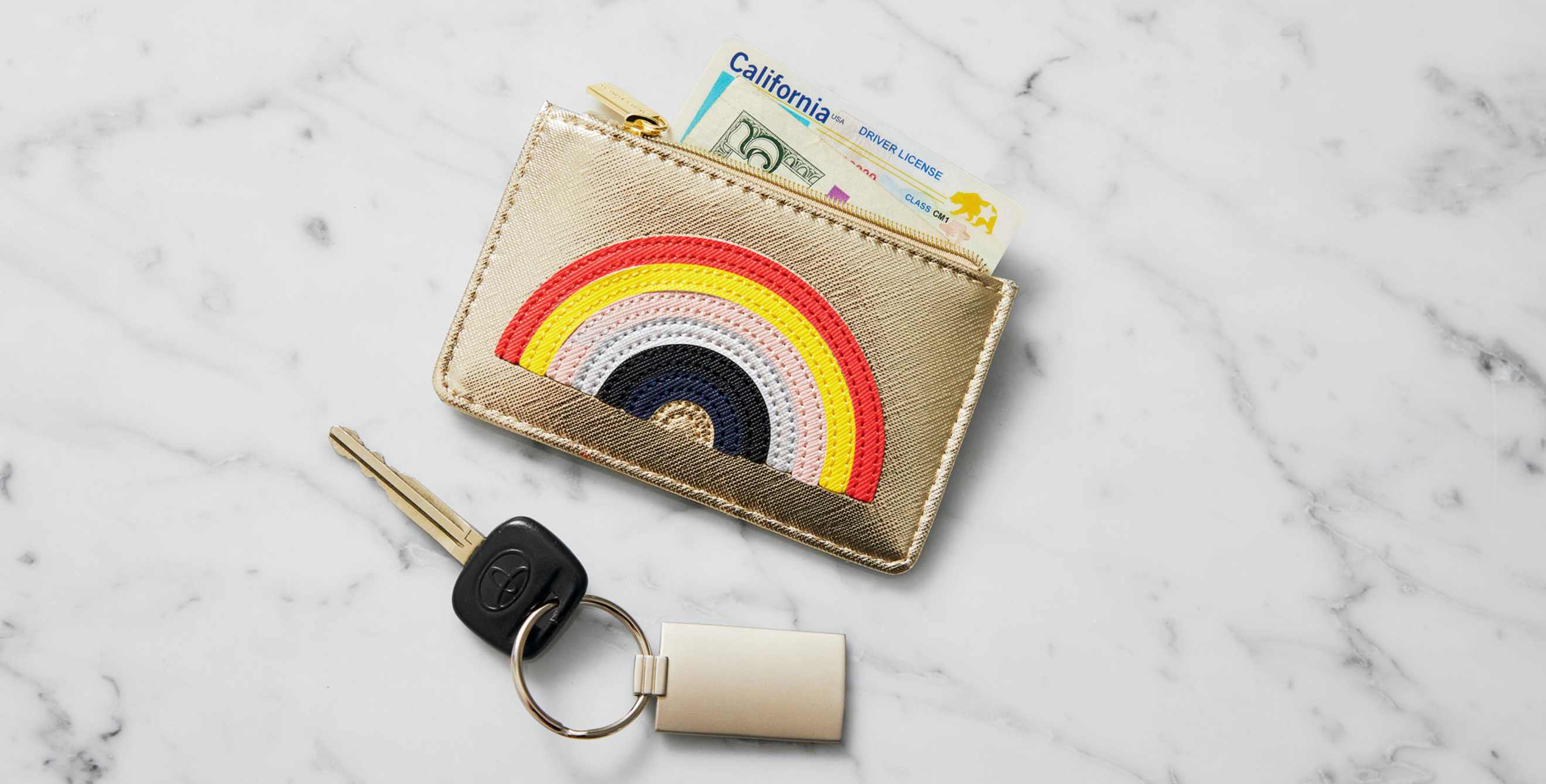 A wallet with a driver's license sticking out.