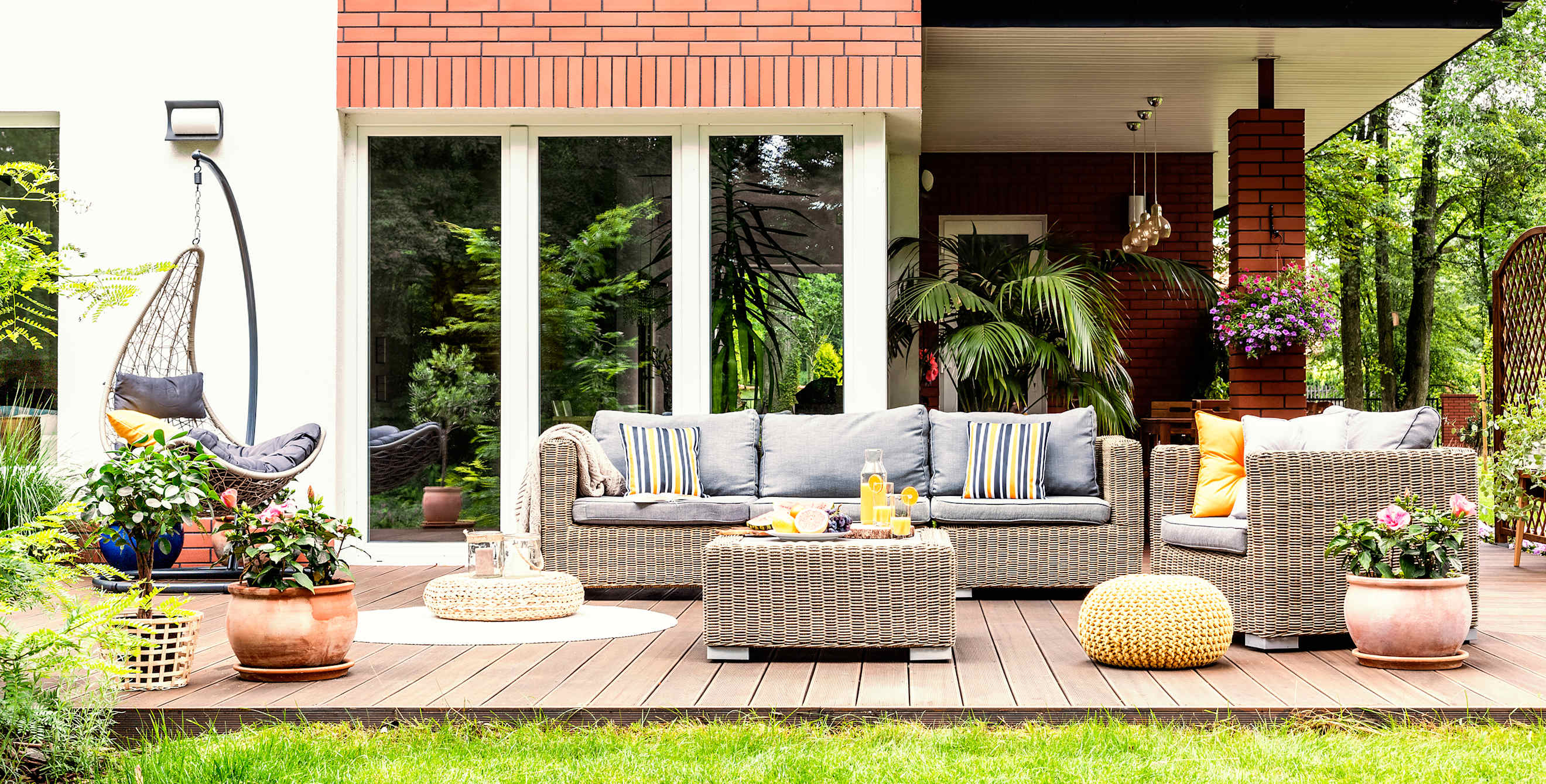 A beautiful patio with a furniture set on a spring day.