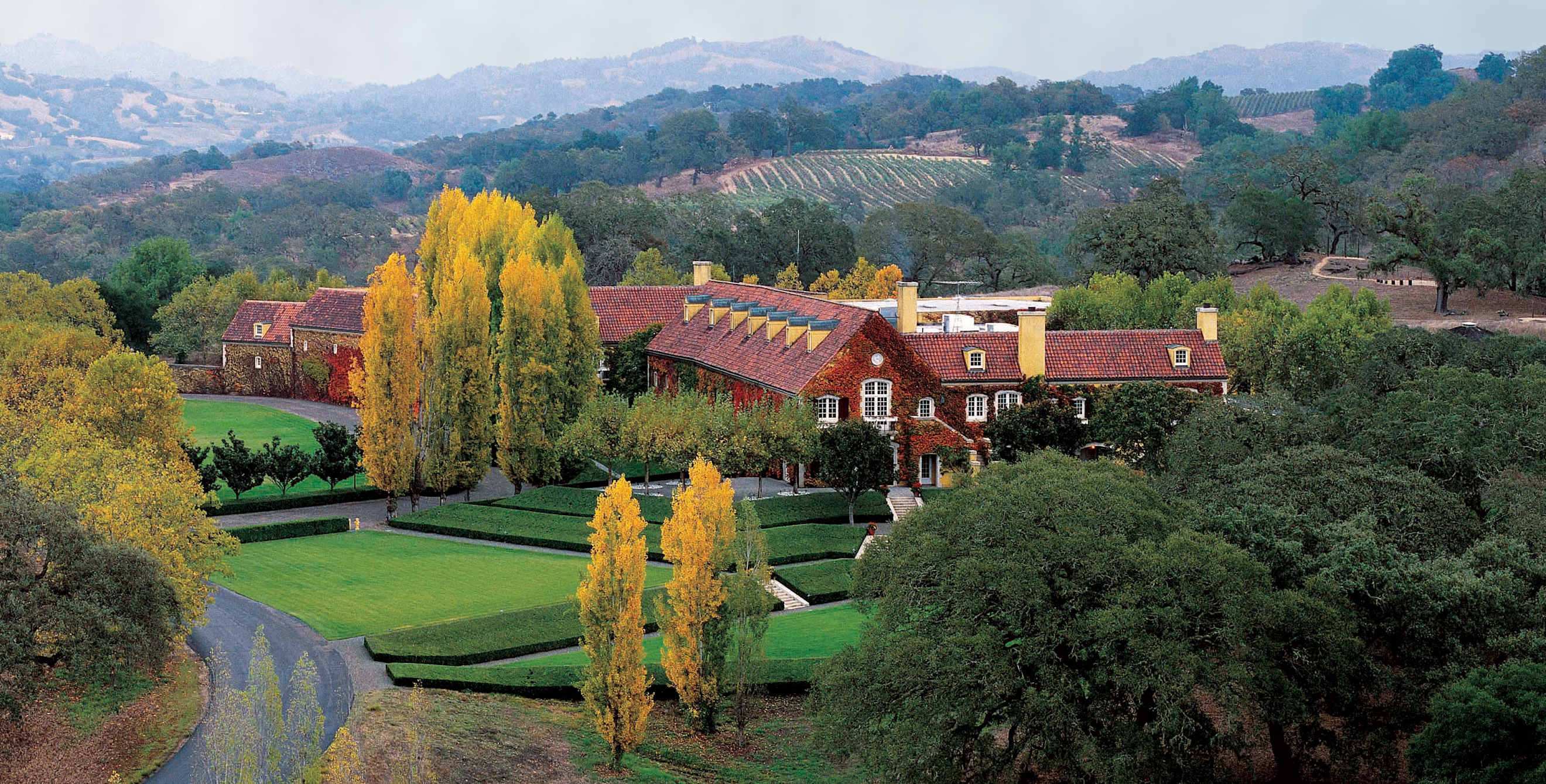 Jordan Winery brick building against lush green grounds.