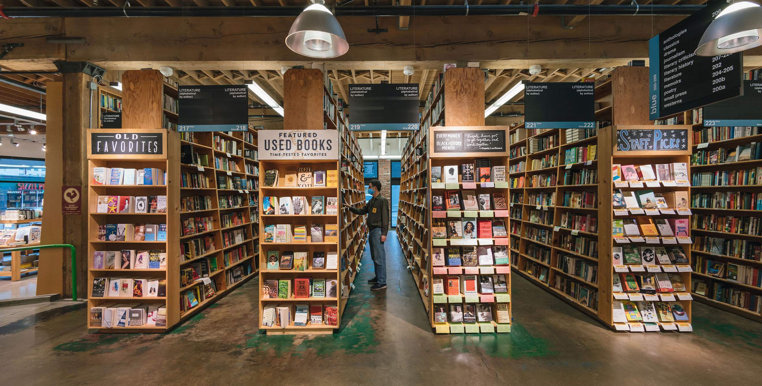A person browses the shelves at Powell's Bookstore in Portland, Oregon.