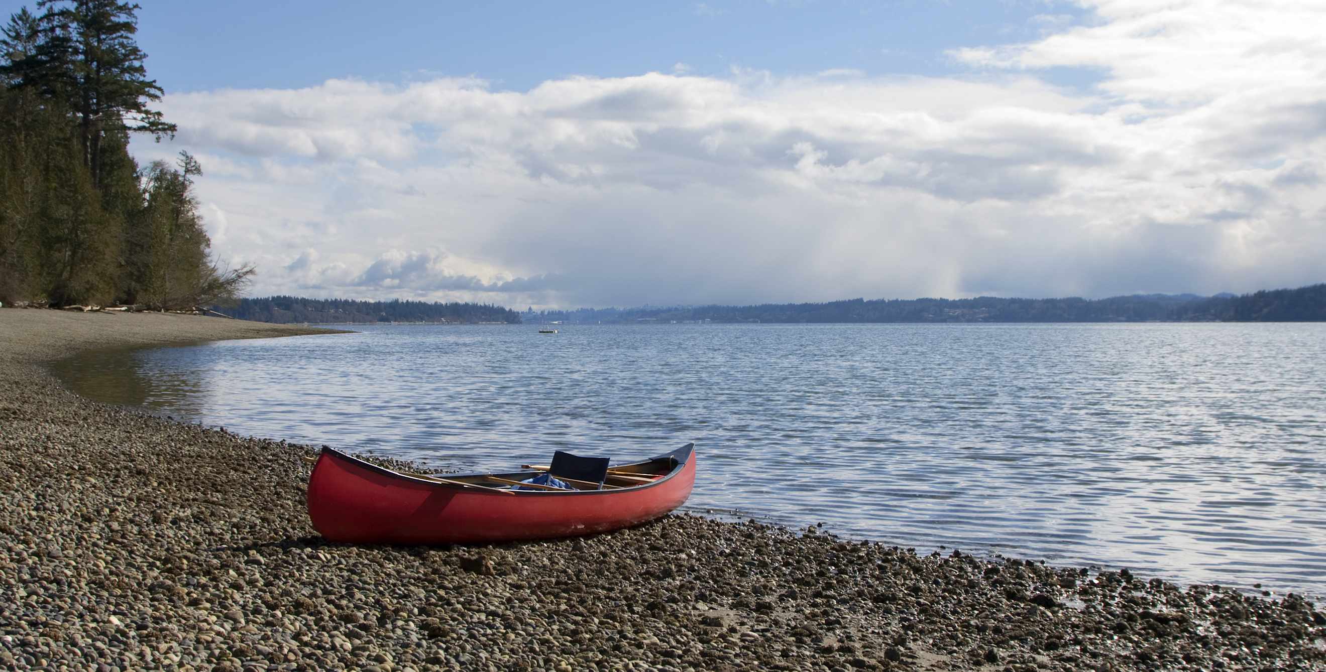A canoe sits on the shore in Olympia, Washington.