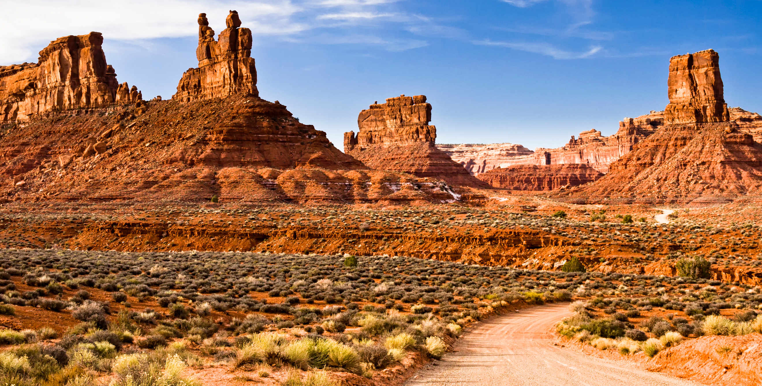 Red rocks against blue sky at the Valley of the Gods in Utah.