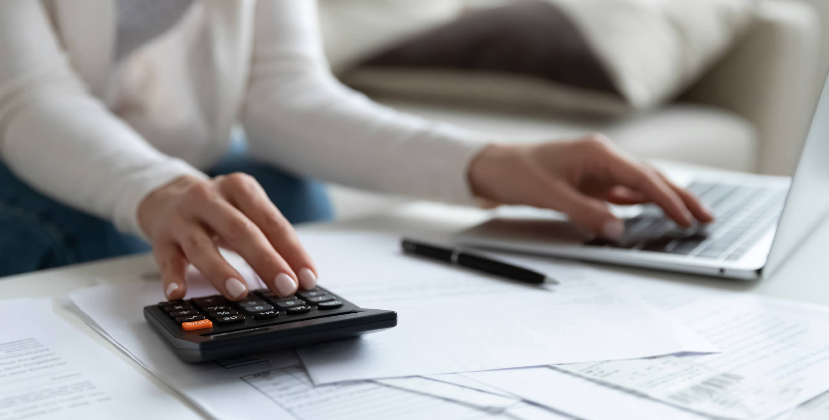 A woman calculates her income taxes.