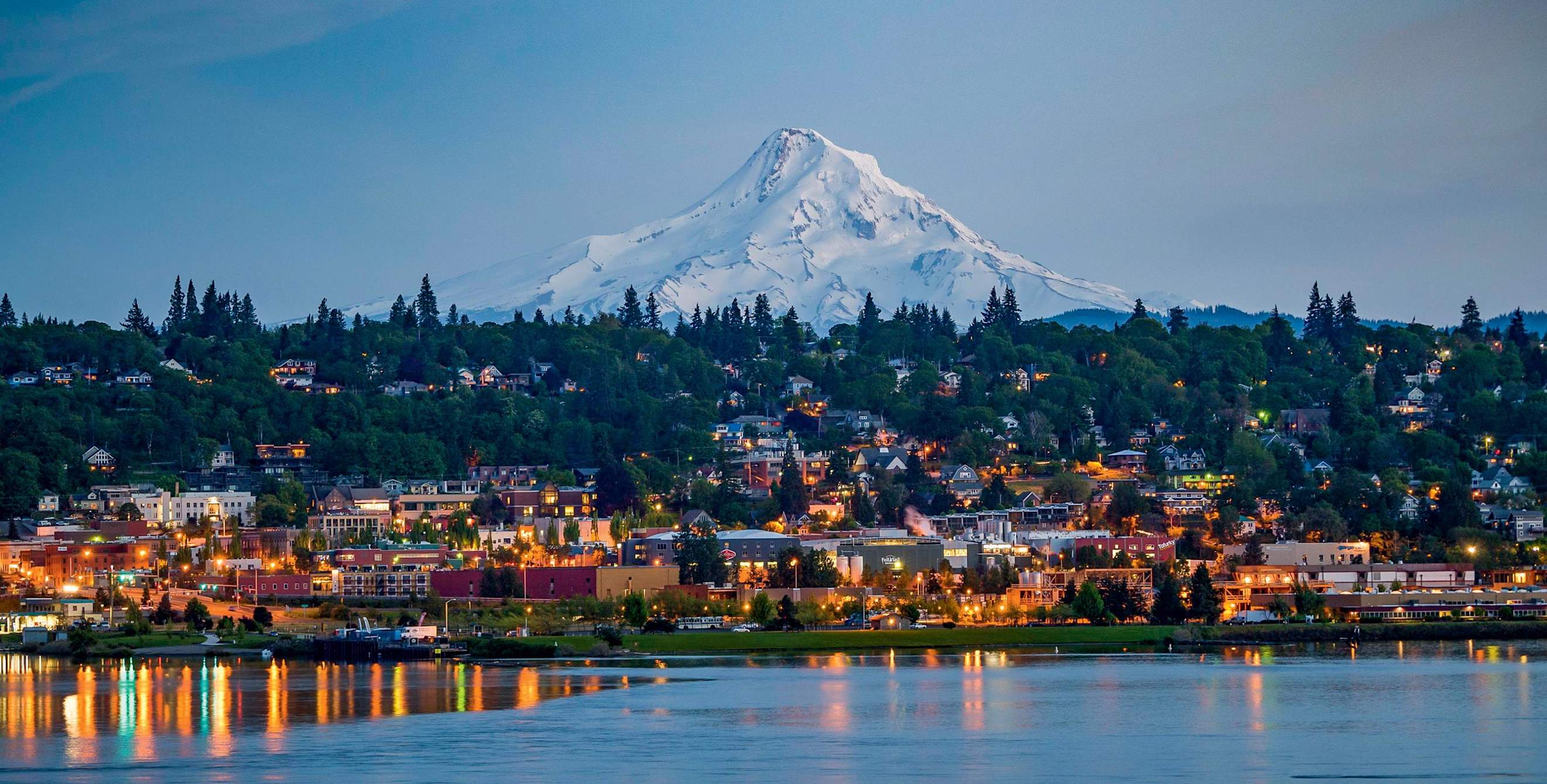 Mount Hood looms over Hood River at dusk.