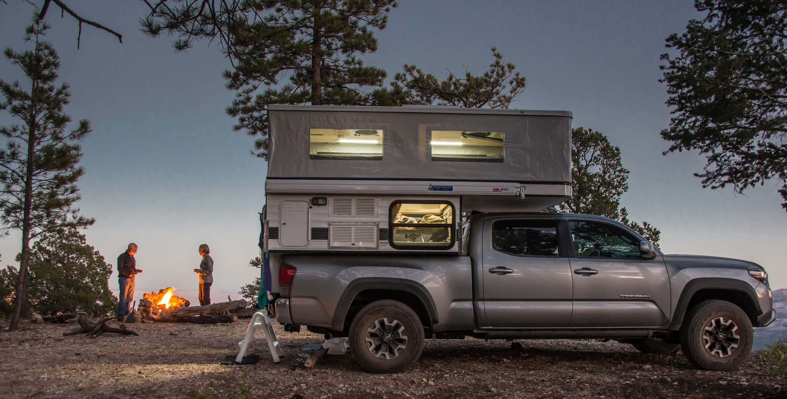 A couple truck camping in Kaibab National Forest.