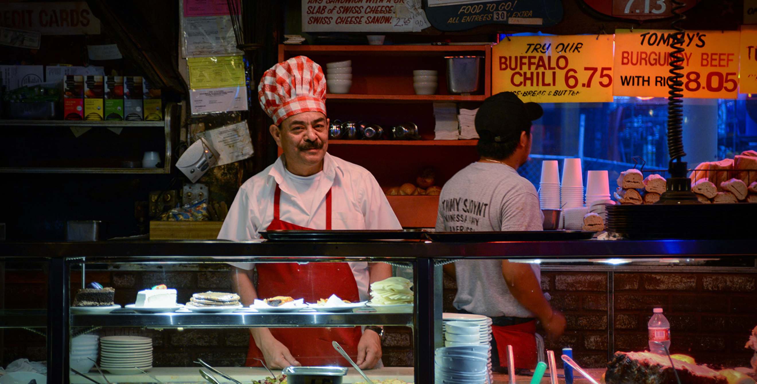 a line chef is ready to serve behind the glass at Tommy's Joynt in San Francisco, California