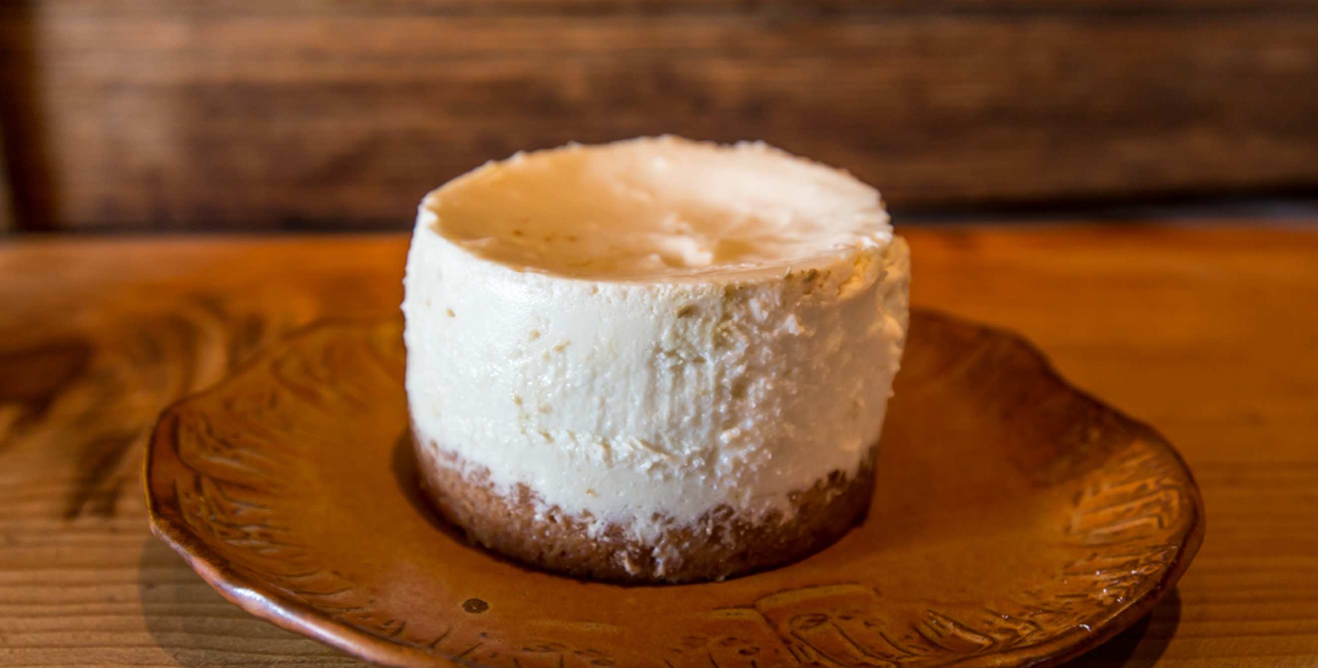 Mini pumpkin cheesecake on a plate at Harley Farms in Pescadero, California, image