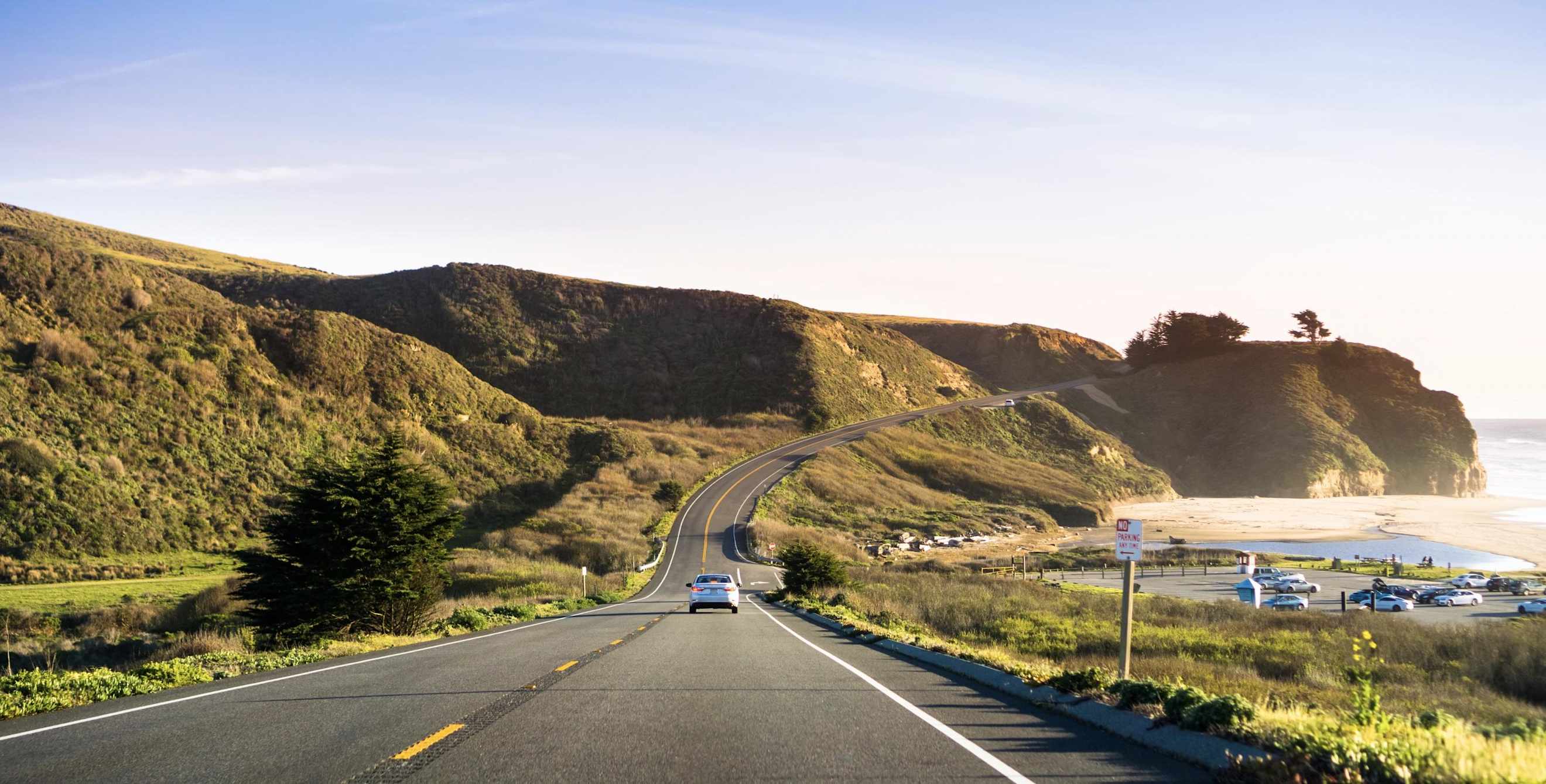 highway 1 running alongside a beach near Half Moon Bay, California