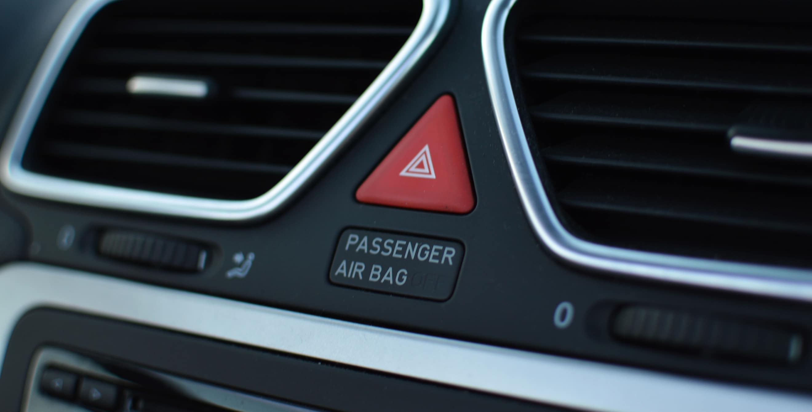 Airbag warning on a vehicle dashboard.