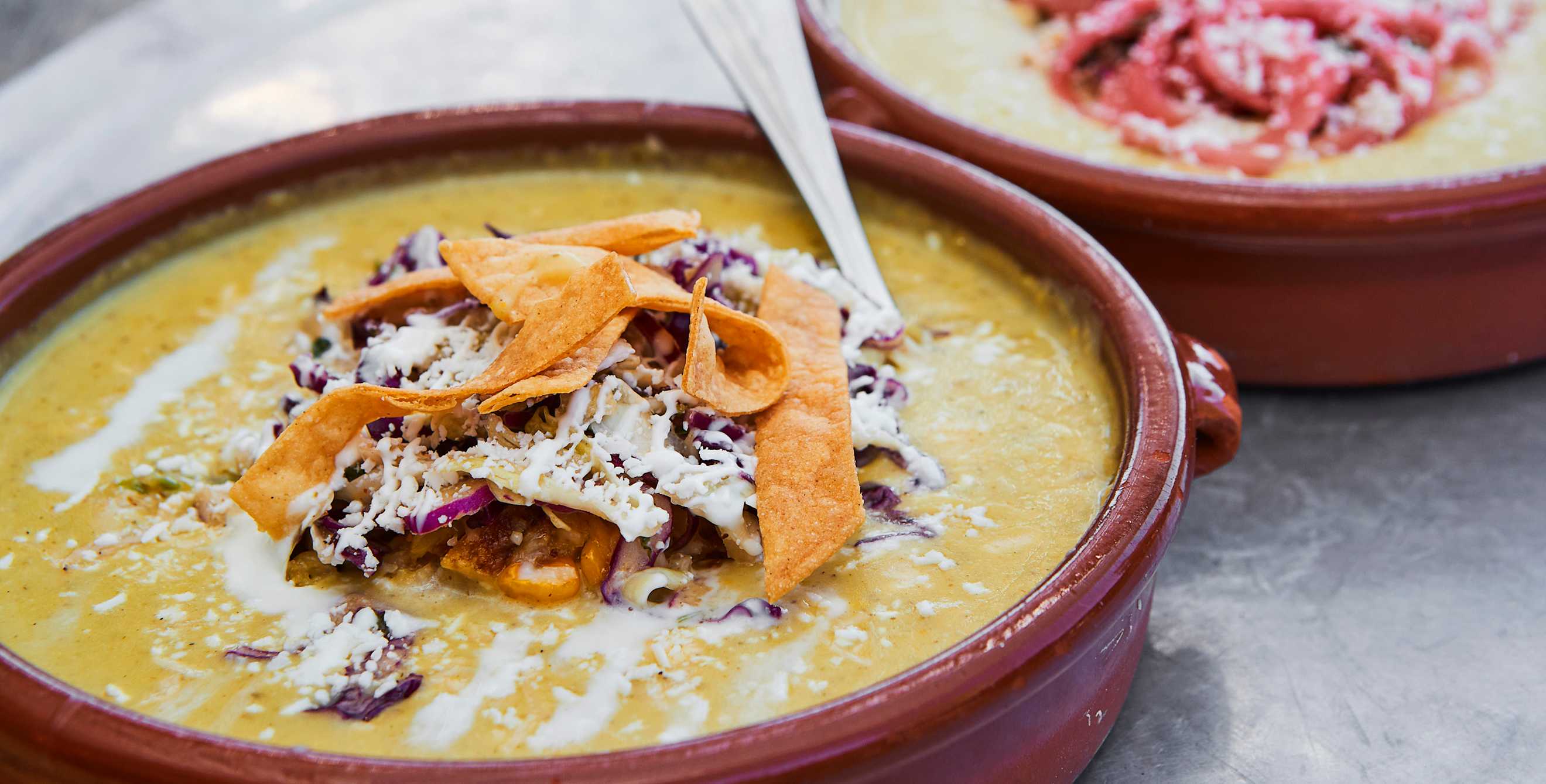 the spicy potato and corn chowder with toppings at Gadzooks Enchiladas & Soup in Phoenix, Arizona