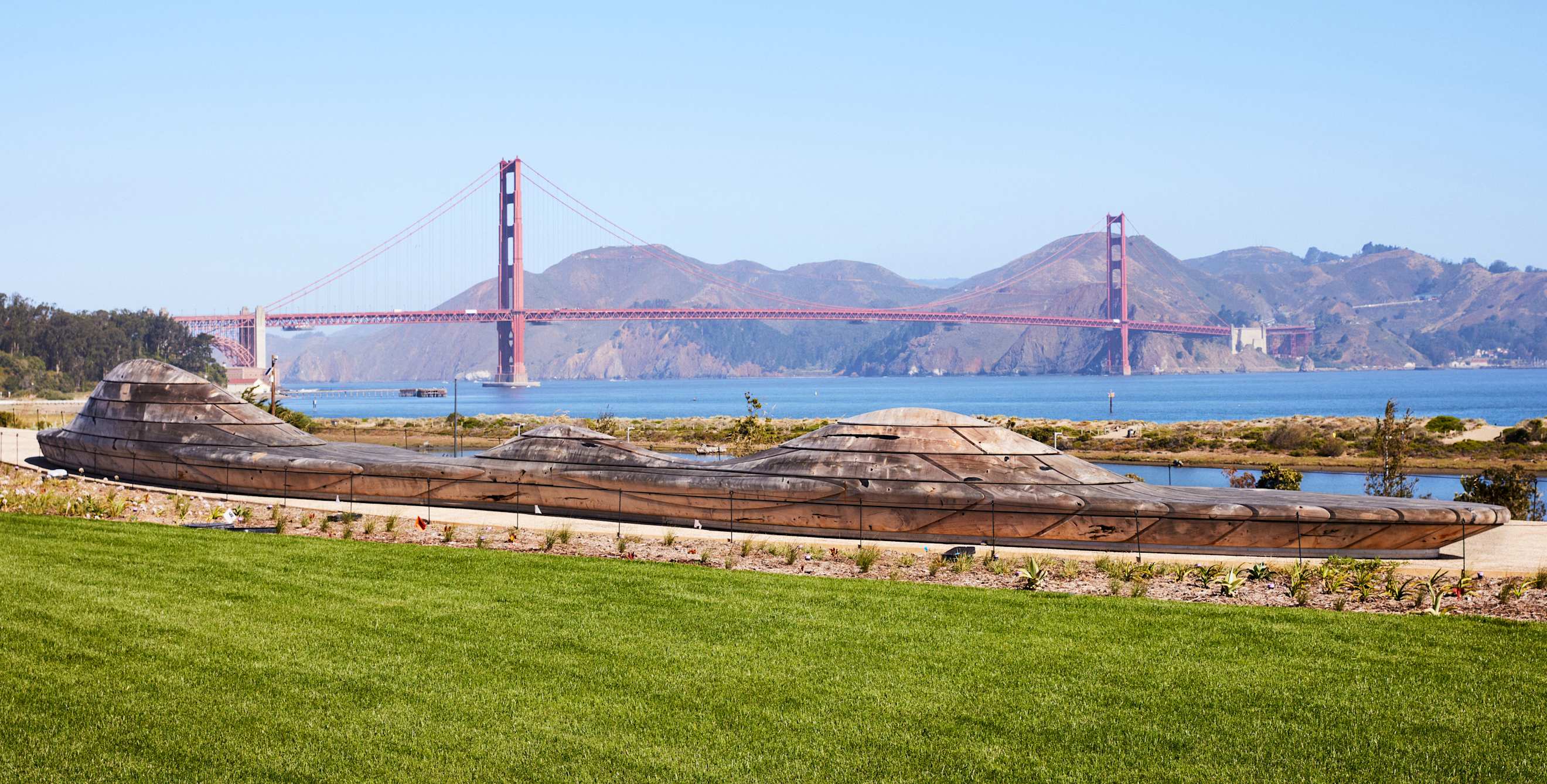 Views of the Golden Gate Bridge on a sunny day from the Presidio Tunnel Tops.