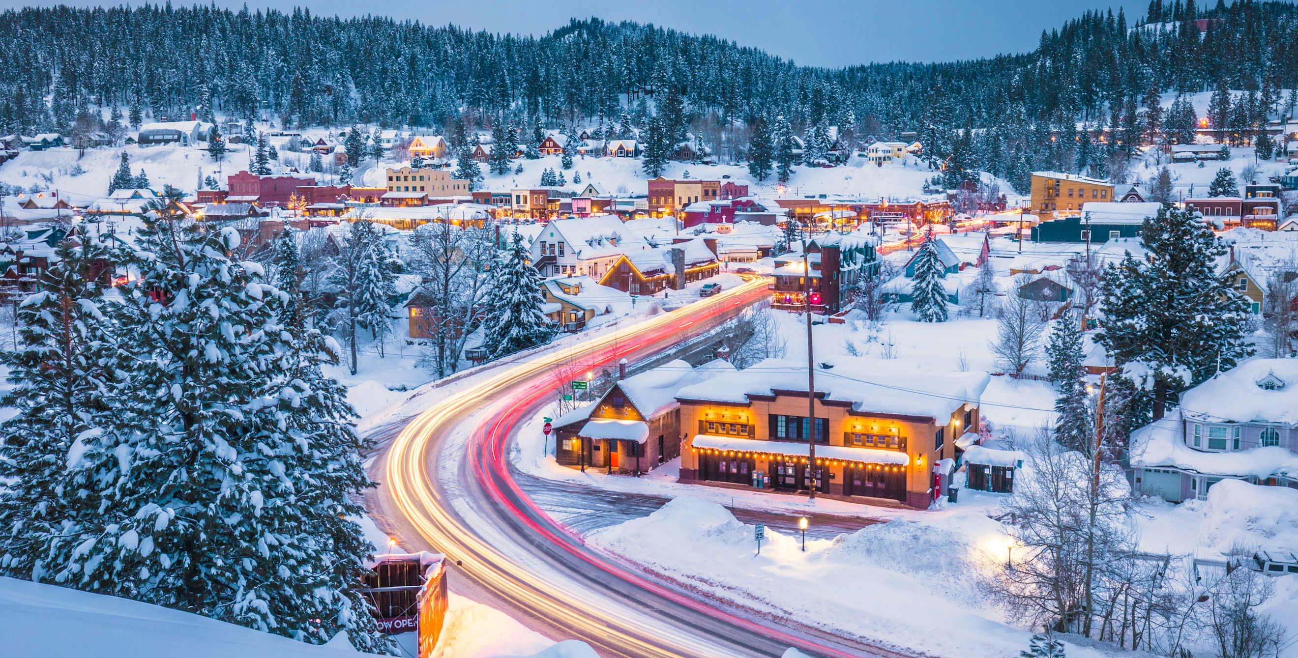 Aerial view of Truckee, California covered in snow at dusk.