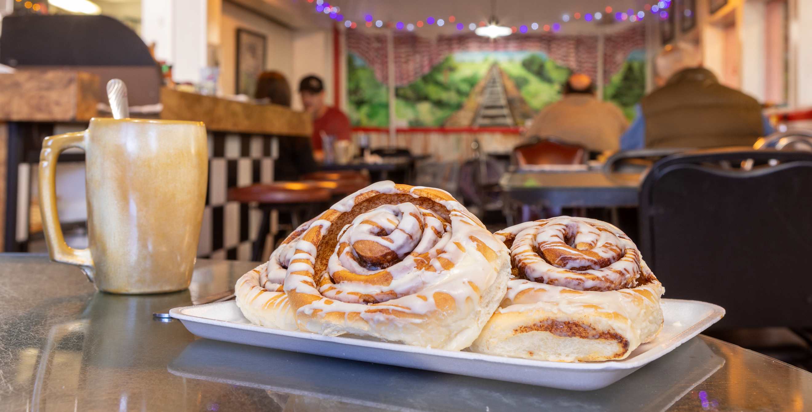 Two cinnamon rolls on a plate at Luxury Diner in Cheyenne, Wyoming.
