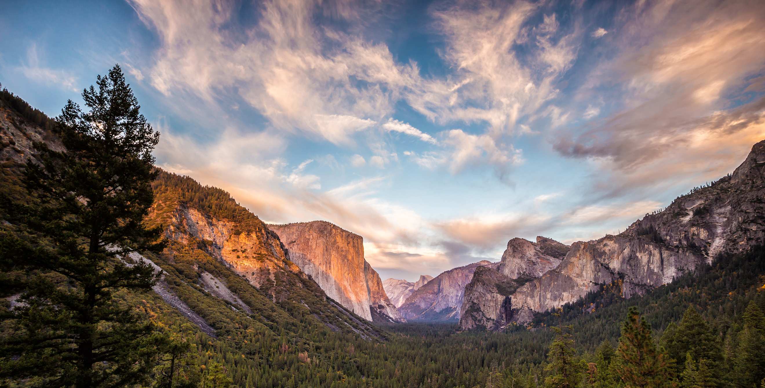 Yosemite Valley on a clear day at sunrise or sunset.