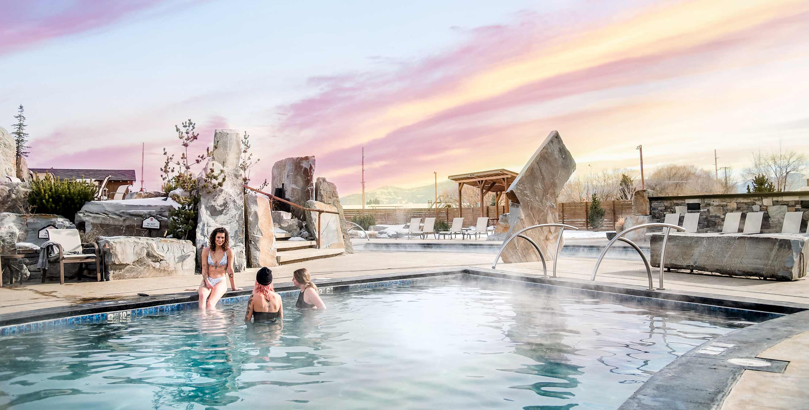 A group of friends soak at the Bozeman Hot Springs in Bozeman, Montana.