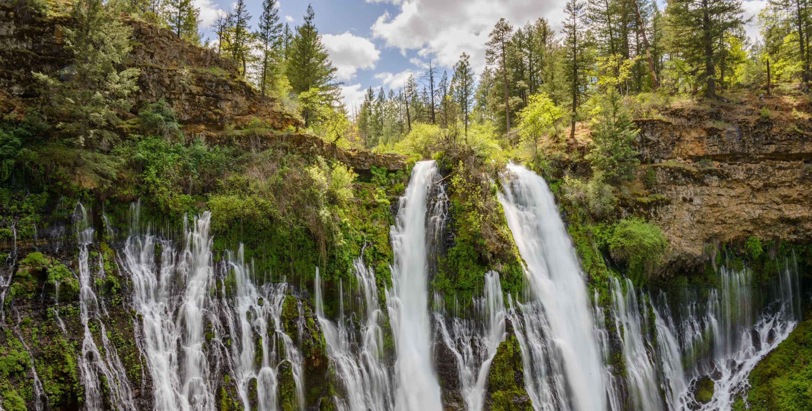 Water rushes down Burney Falls in McArthur Memorial Park, California.