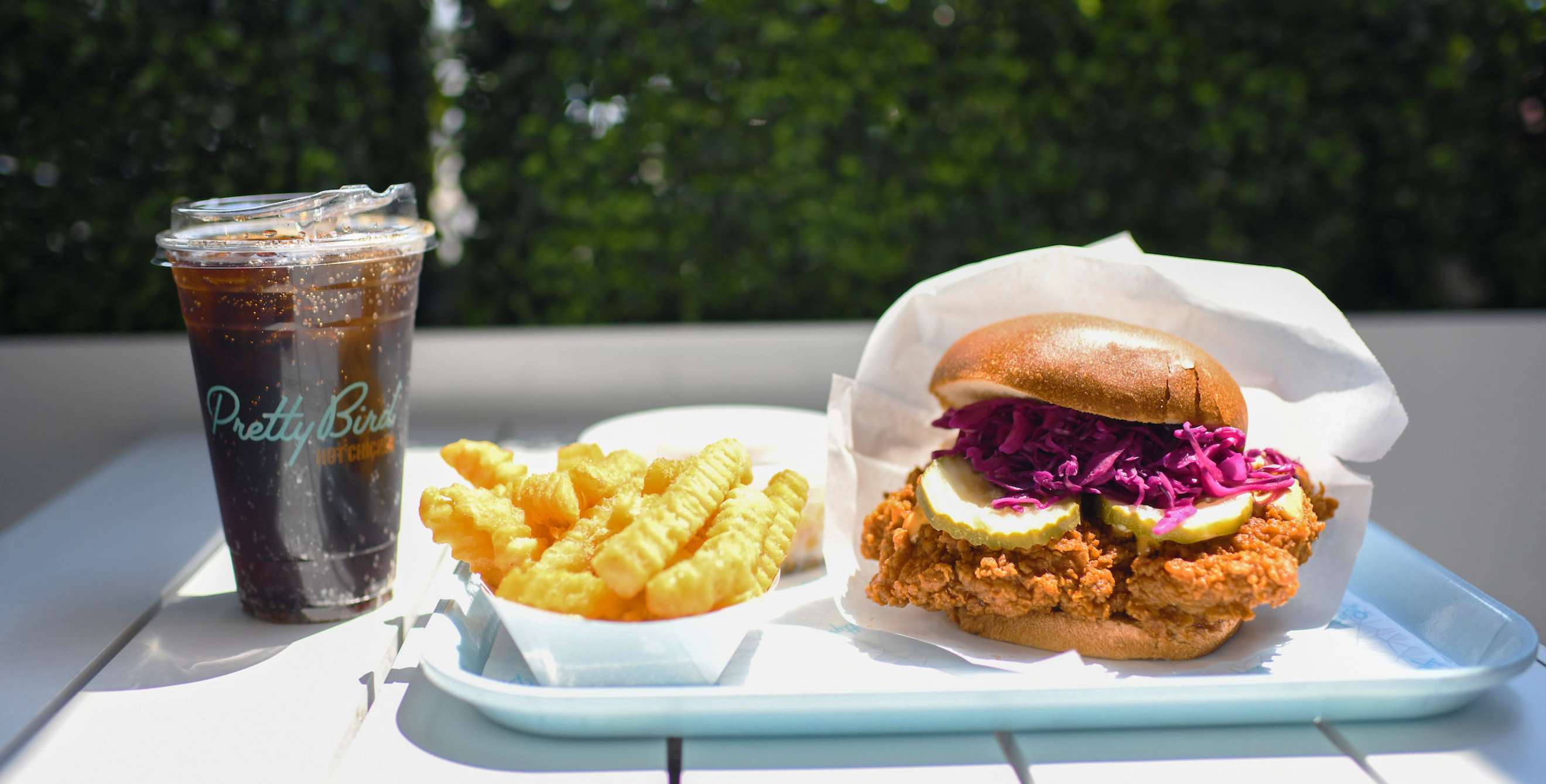 Fried chicken sando combo outside at Pretty Bird in Salt Lake City.