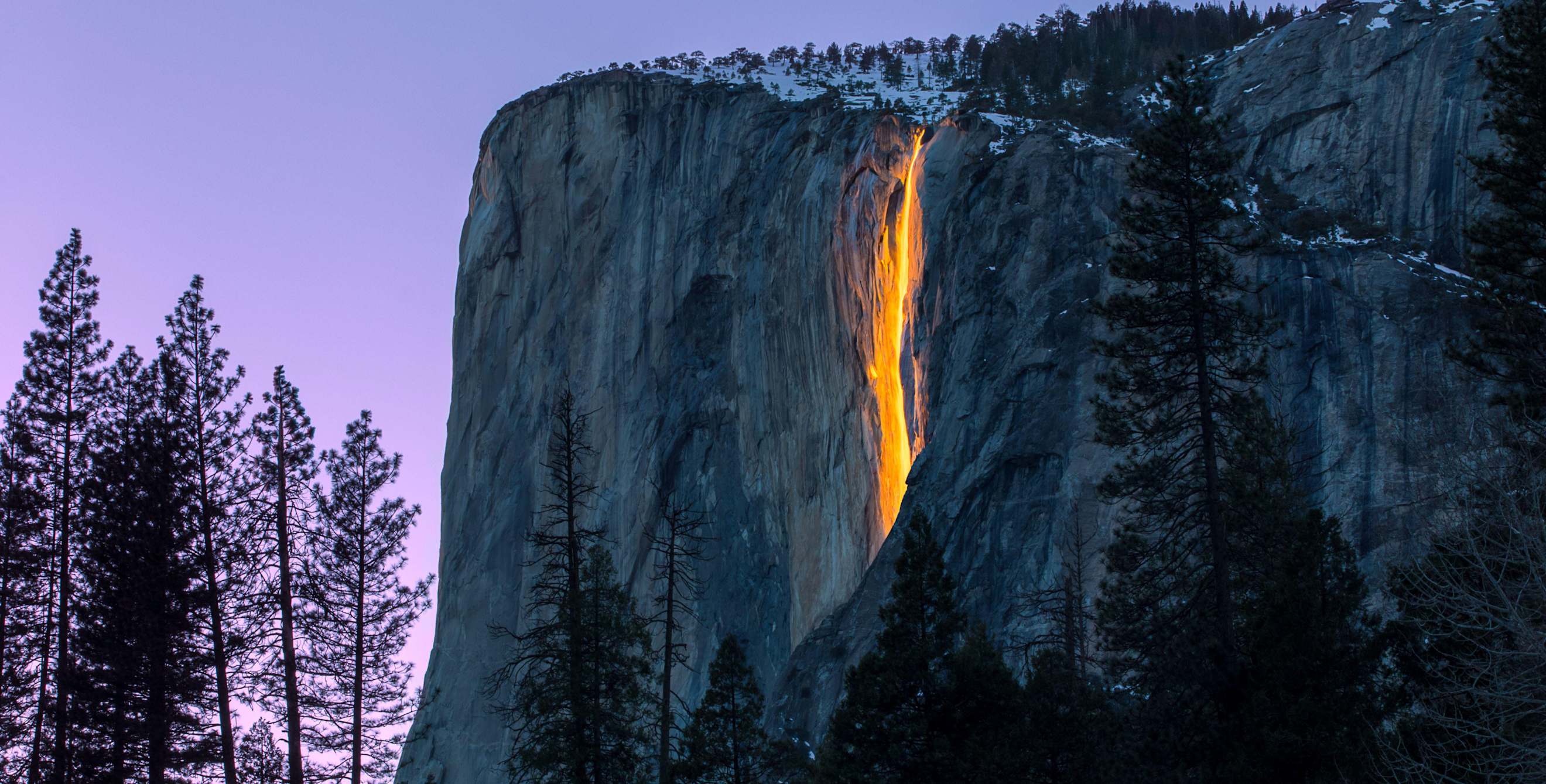 Yosemite National Park's firefall lit up at sunset.