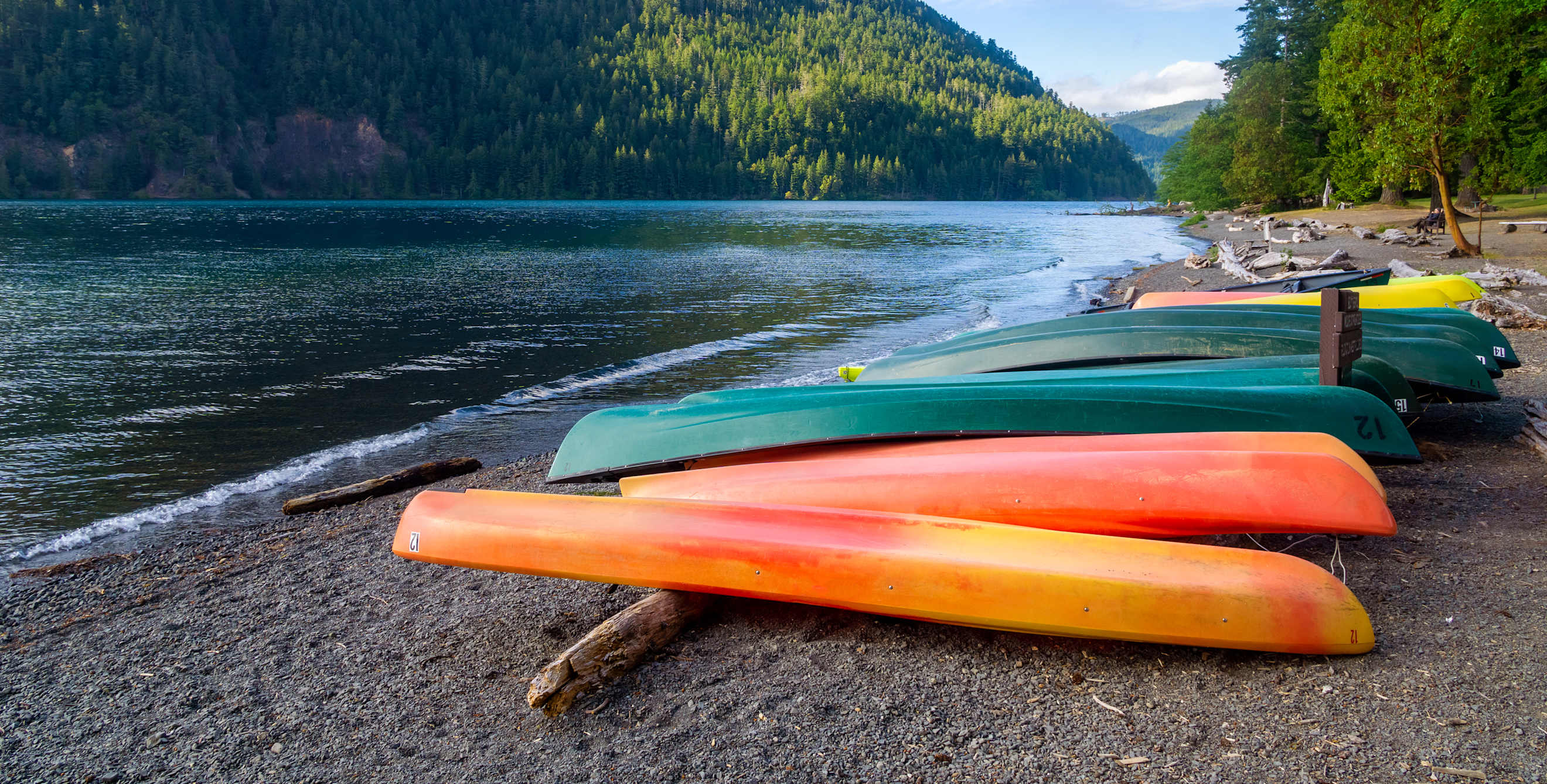 Kayaks on the shore of Lake Crescent in Washington's Olympic National Park.