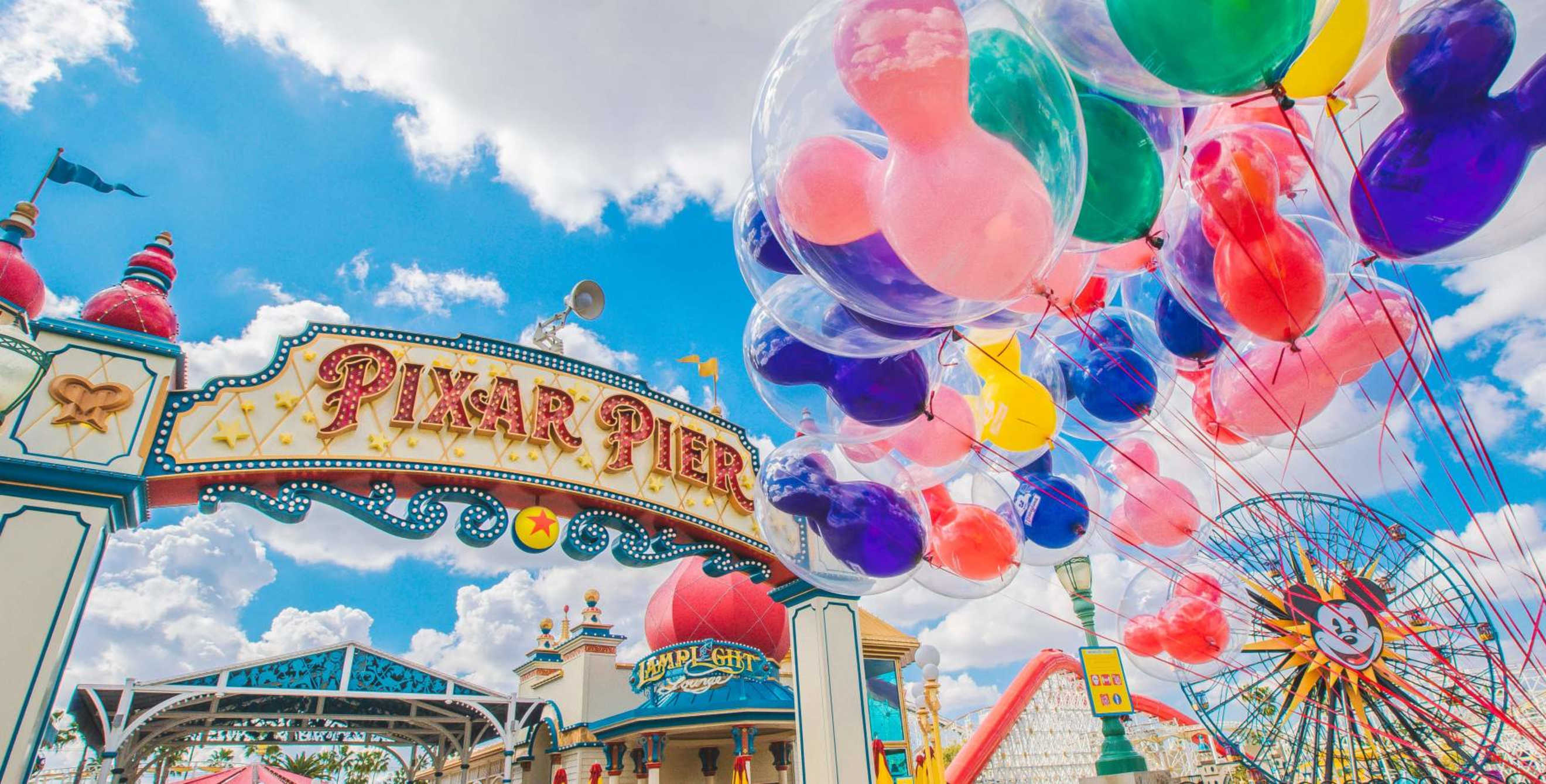 Balloons outside the pixar pier sign at Disneyland Resort's California Adventure.