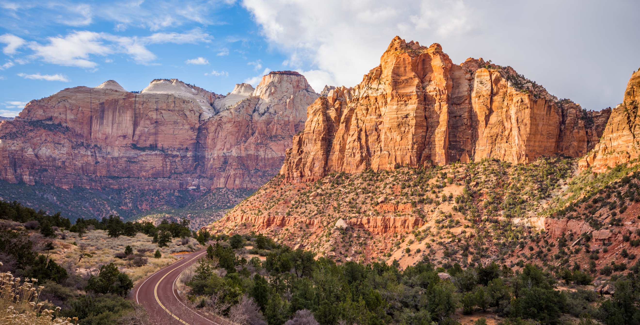 A road cuts through Zion National Park in Utah.