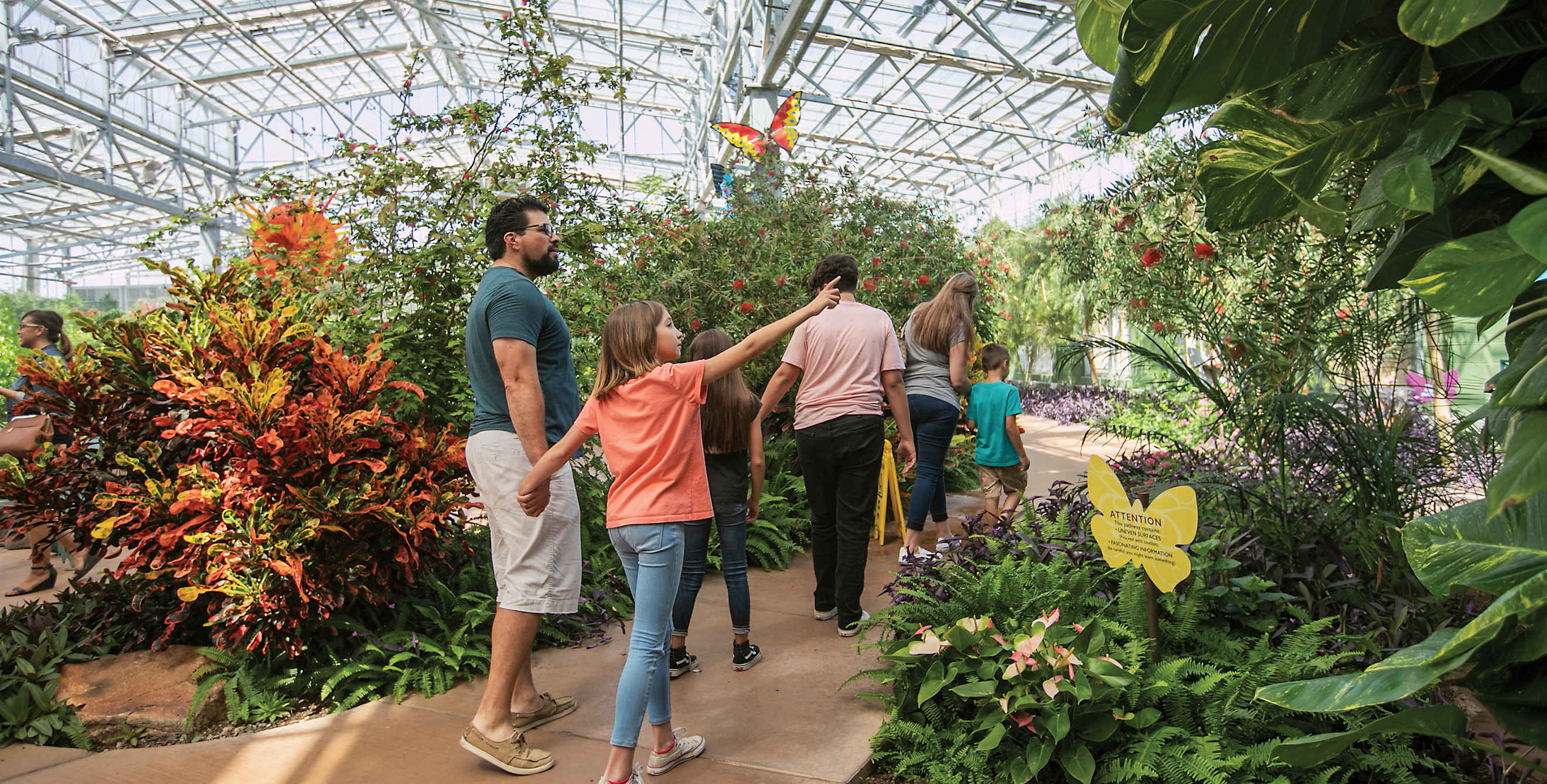 A family wanders through Butterfly Wonderland in Scottsdale, Arizona